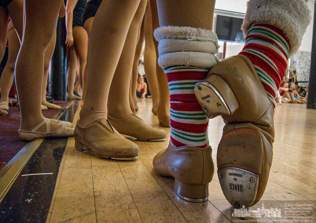 A tap dancer stretches her foot during a pause in rehearsals for Generations’ Christmas recital in early December. My Final Photo for Nov. 12, 2016.