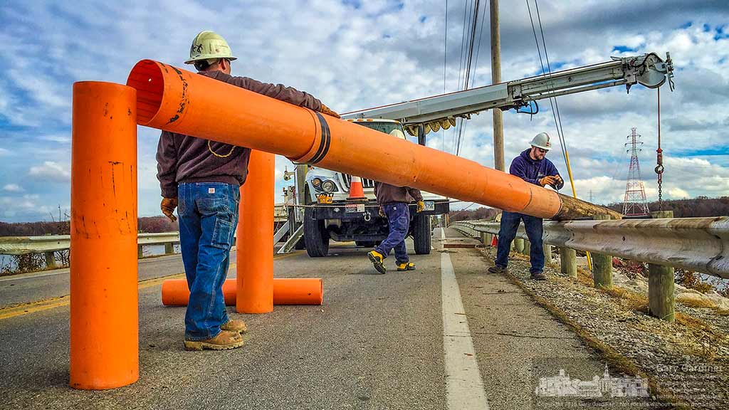 AEP Workers check the installation of plastic insulators temporarily installed on a new power pole they are installing along Smothers Road across Hoover Reservoir. My Final Photo for Nov. 29, 2016.