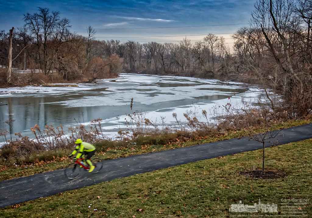 A bicyclist makes his way under the Main Street Bridge along the bike trail that parallels Alum Creek through Westerville, Ohio. My Final Photo for Dec. 21, 2016.