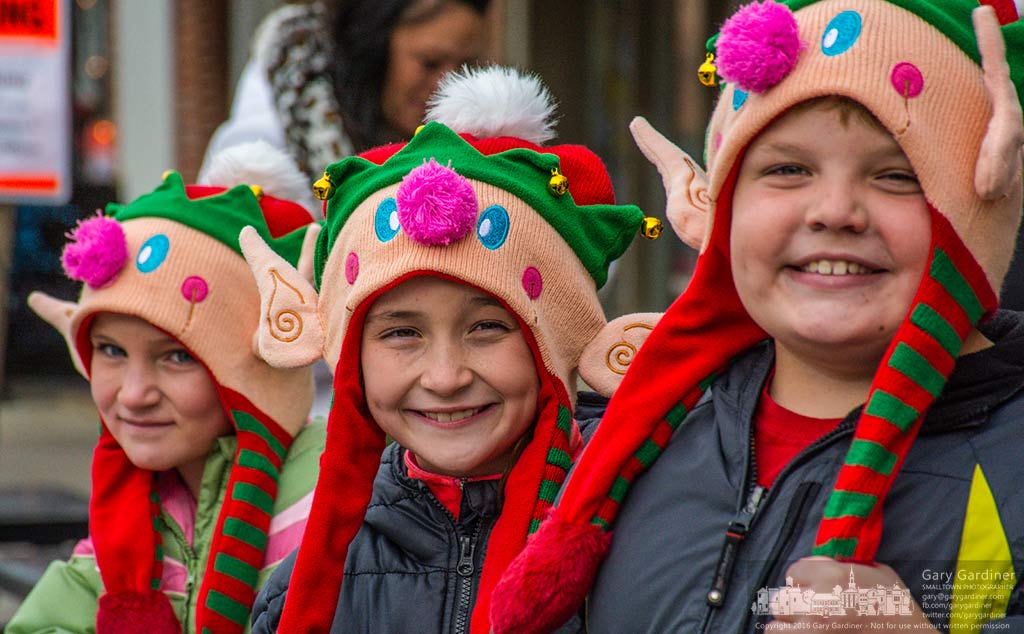 A trio of elves with wiggling ears stand on the edge of t he street in Uptown Westerville eagerly waiting for the arrival of Santa Claus in the annual Christmas Parade. My Final Photo for Dec. 4, 2016.