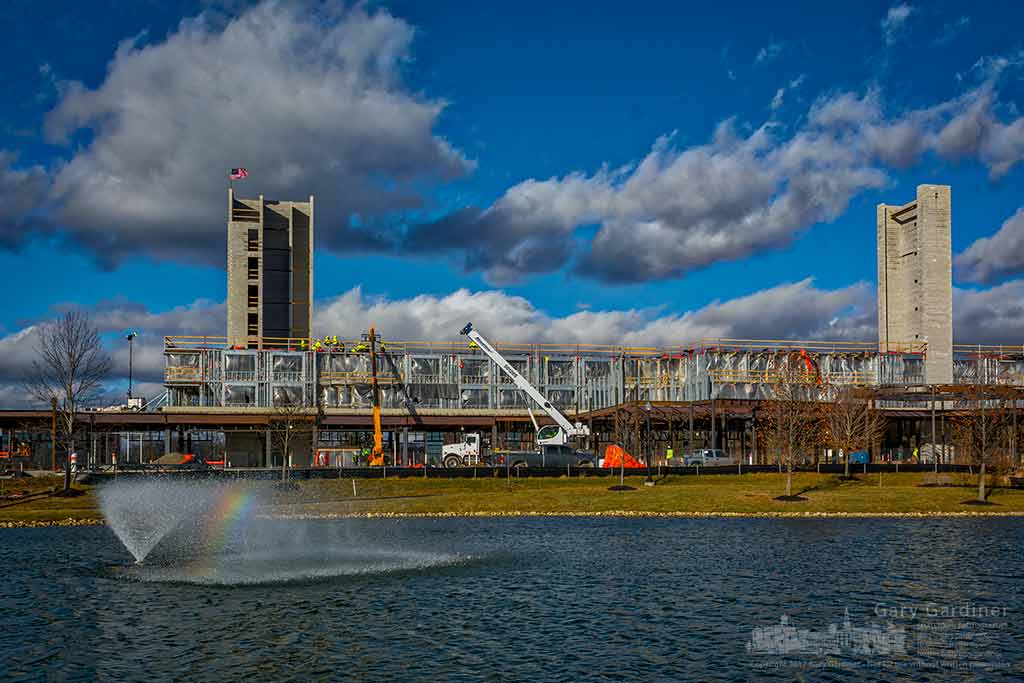 A rainbow forms in a fountain blown in the wind in a retention pond adjacent to the Marriott Renaissance hotel being build in Westar in Westerville, Ohio. My Final Photo for Jan. 4, 2016.