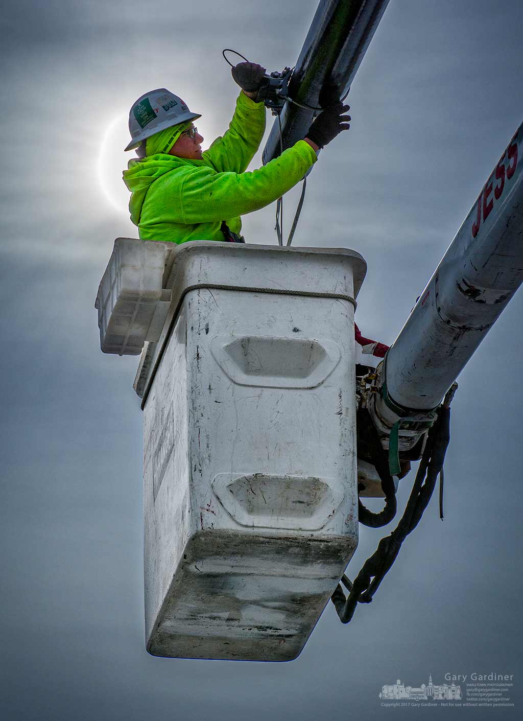 An electrician pulls cable through an arm of the new traffic signals supports at Otterbein and Schrock Road as construction resumes after the new year. My Final Photo for Jan. 9, 2017.
