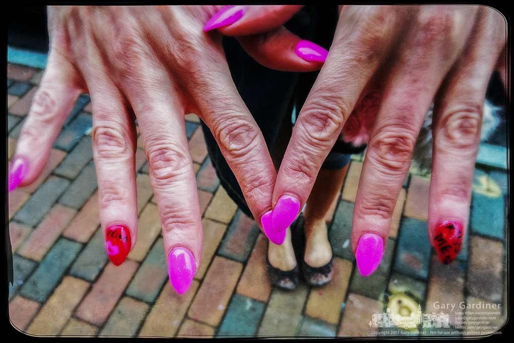 Diana proudly shows off her new pink nails as she walks through Uptown Westerville. My Final Photo for Feb. 15, 2017.