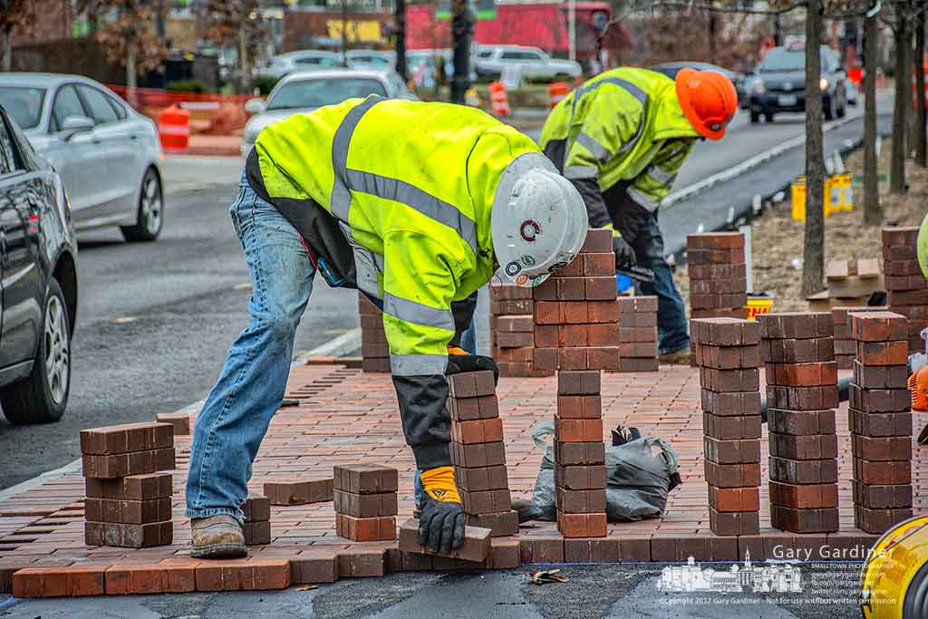 Bricklayers place several thousand square feet of brick in the median and sidewalks of State Street north of Schrock Road as upgrading the roadway enters into another phase. My Final Photo for Feb. 28, 2017.