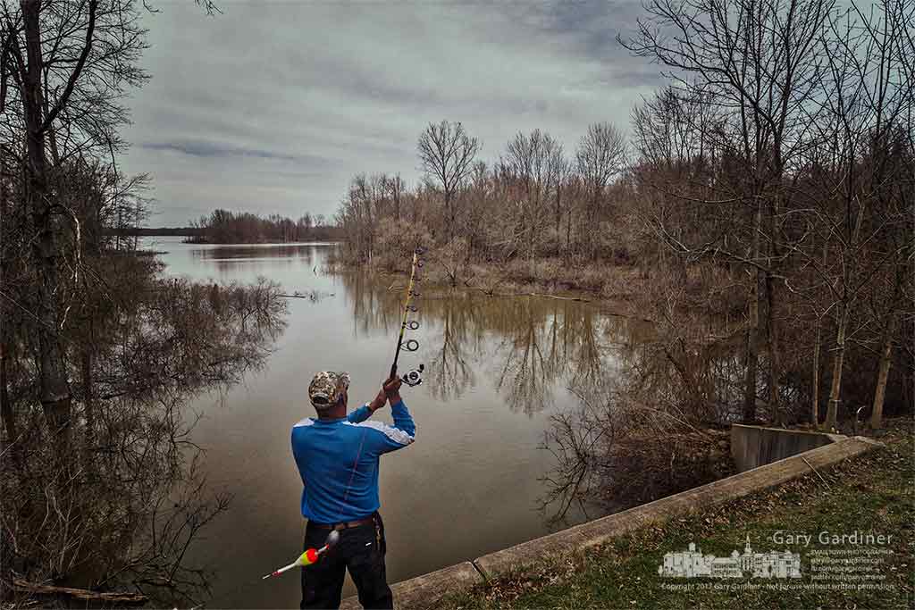 Elbert Hill tosses a freshly baited hook into Hoover Reservoir at his favorite fishing spot along Big Walnut Road. My Final Photo for March 30, 2017.