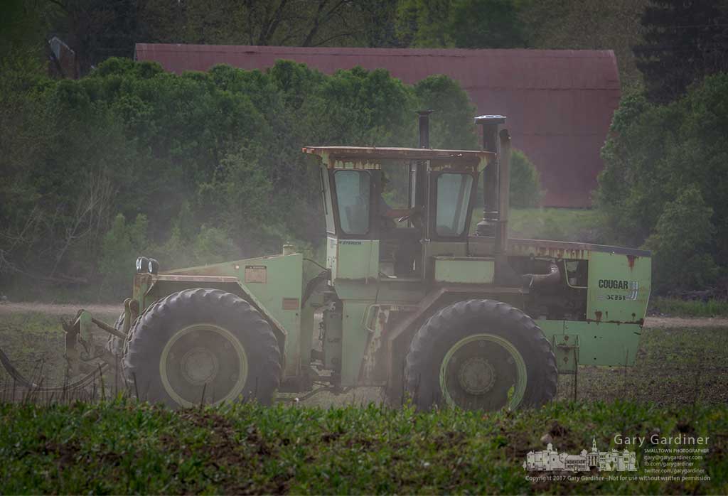 The fields at Braun Farm along Cooper road gets its annual plowing to turn under the early growth of weeds on the land that may see its last crop this season. My Final Photo for April 20, 2017.