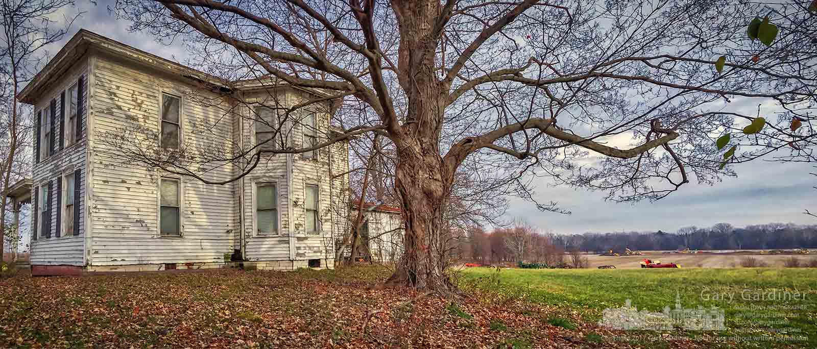 The old farmhouse on the Braun Farm sits beside a maple tree along Cleveland Ave. with a senior housing project being built on the opposite end of the property along Cooper Road. My Final Photo for Dec. 11, 2017.