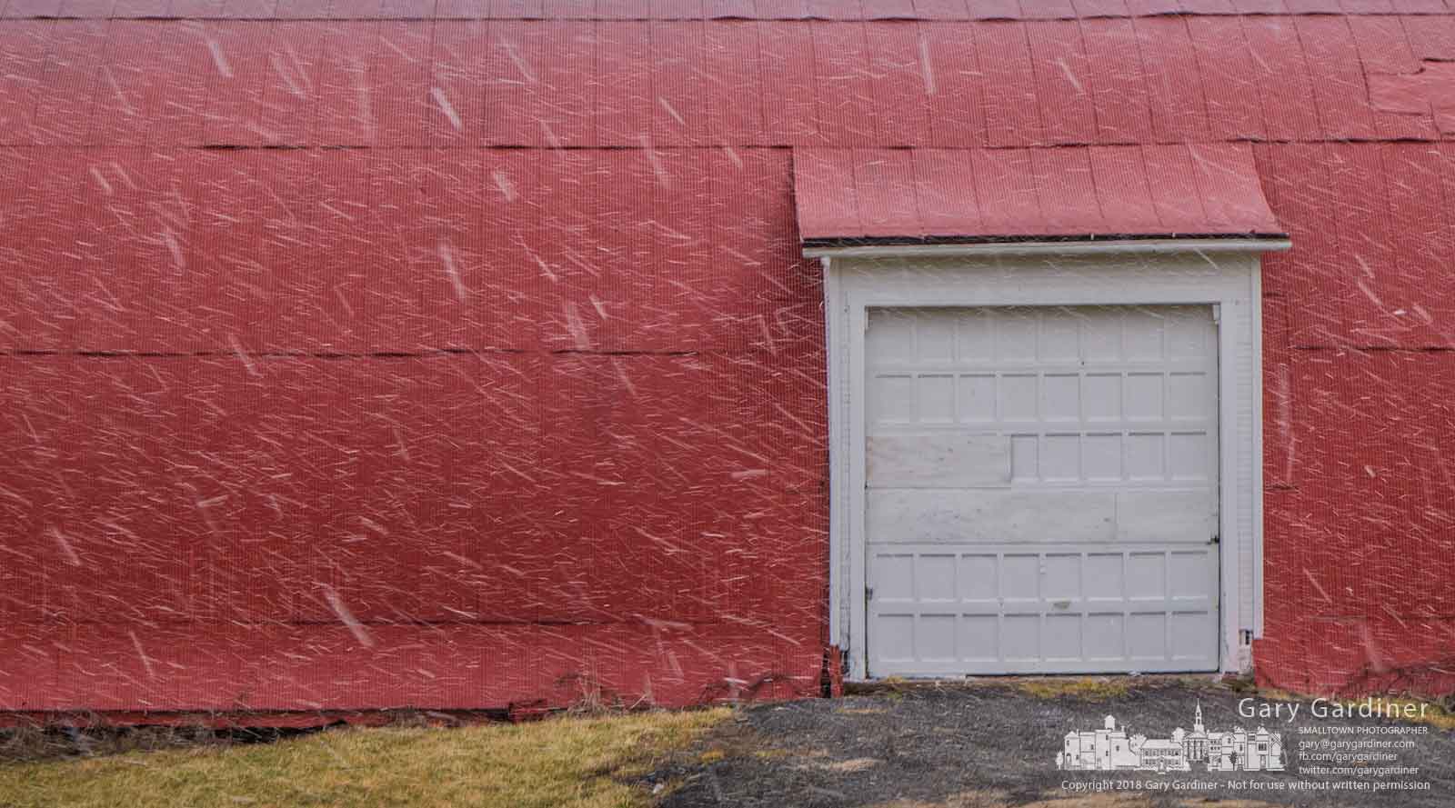 Eddys of snow from an afternoon squall fall across the entrance to the Braun Farm. My Final Photo for Jan. 29, 2018.