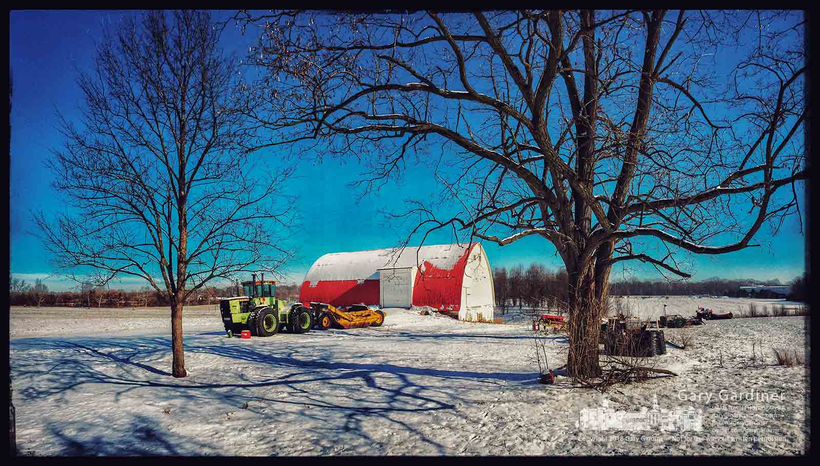 The tractor, barn, and bee hives sit in a blanket of snow on the Braun Farm property in Westerville, Ohio. My Final Photo for Jan. 2, 2018.
