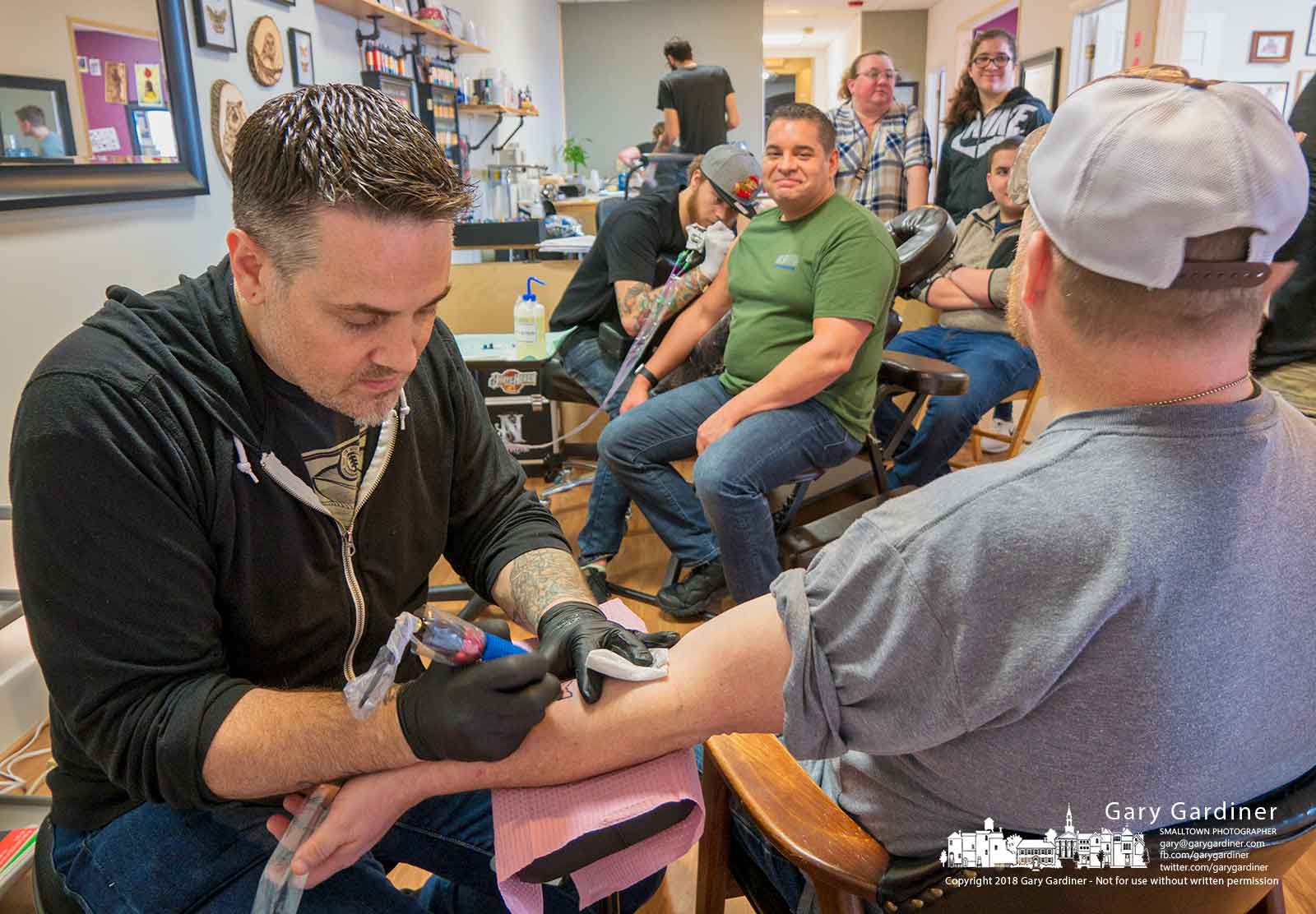 White Raven Tattoo Studio artists create Westerville BlueThin Line tattoos for customers whose money will be donated for use by the children of police officers Morelli and Joering who were killed two weeks ago. My Final Photo for Feb. 24, 2018.