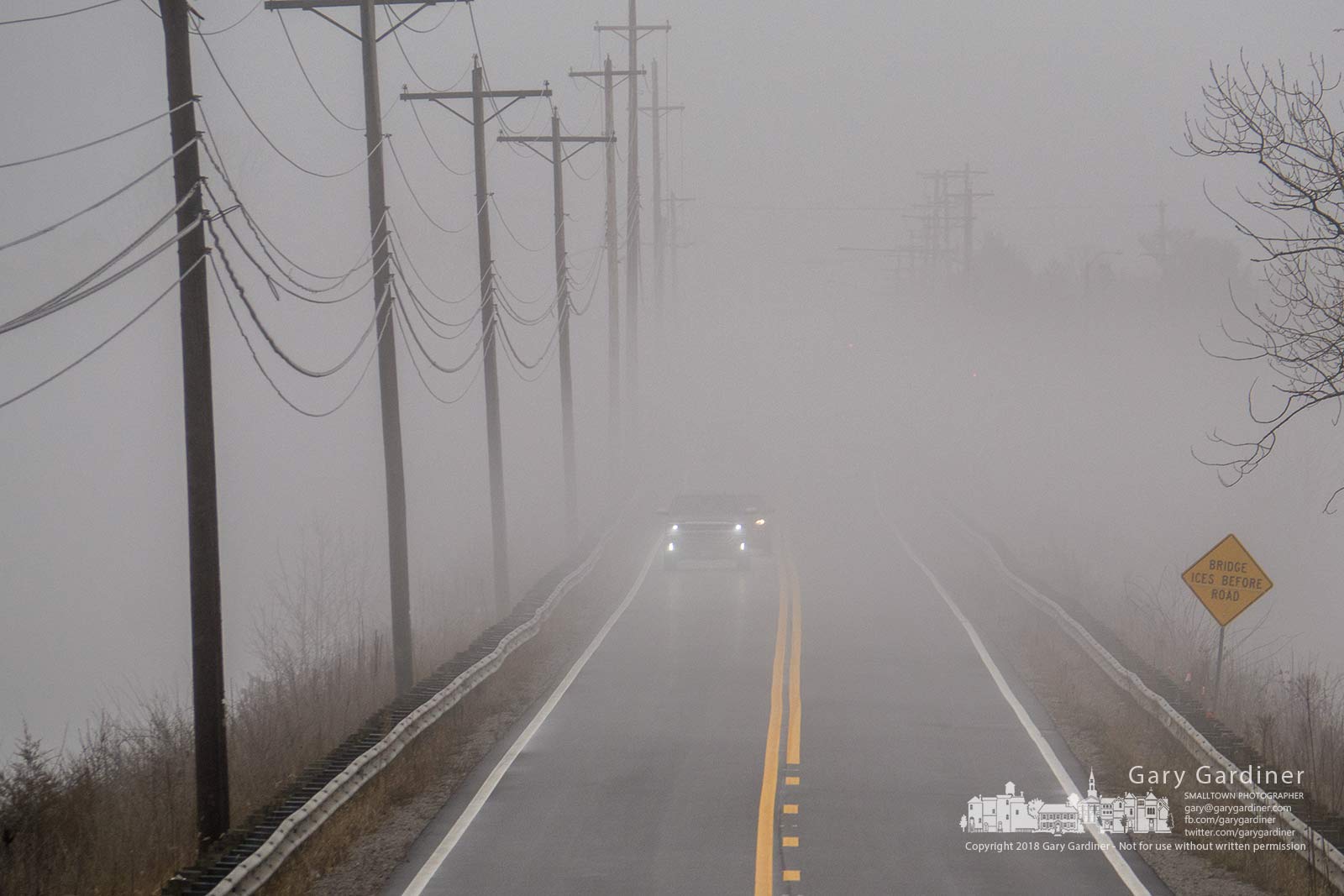 Drivers in early afternoon commuter traffic navigate their way through heavy fog across the Smothers Road bridge. My Final Photo for March 28, 2019.