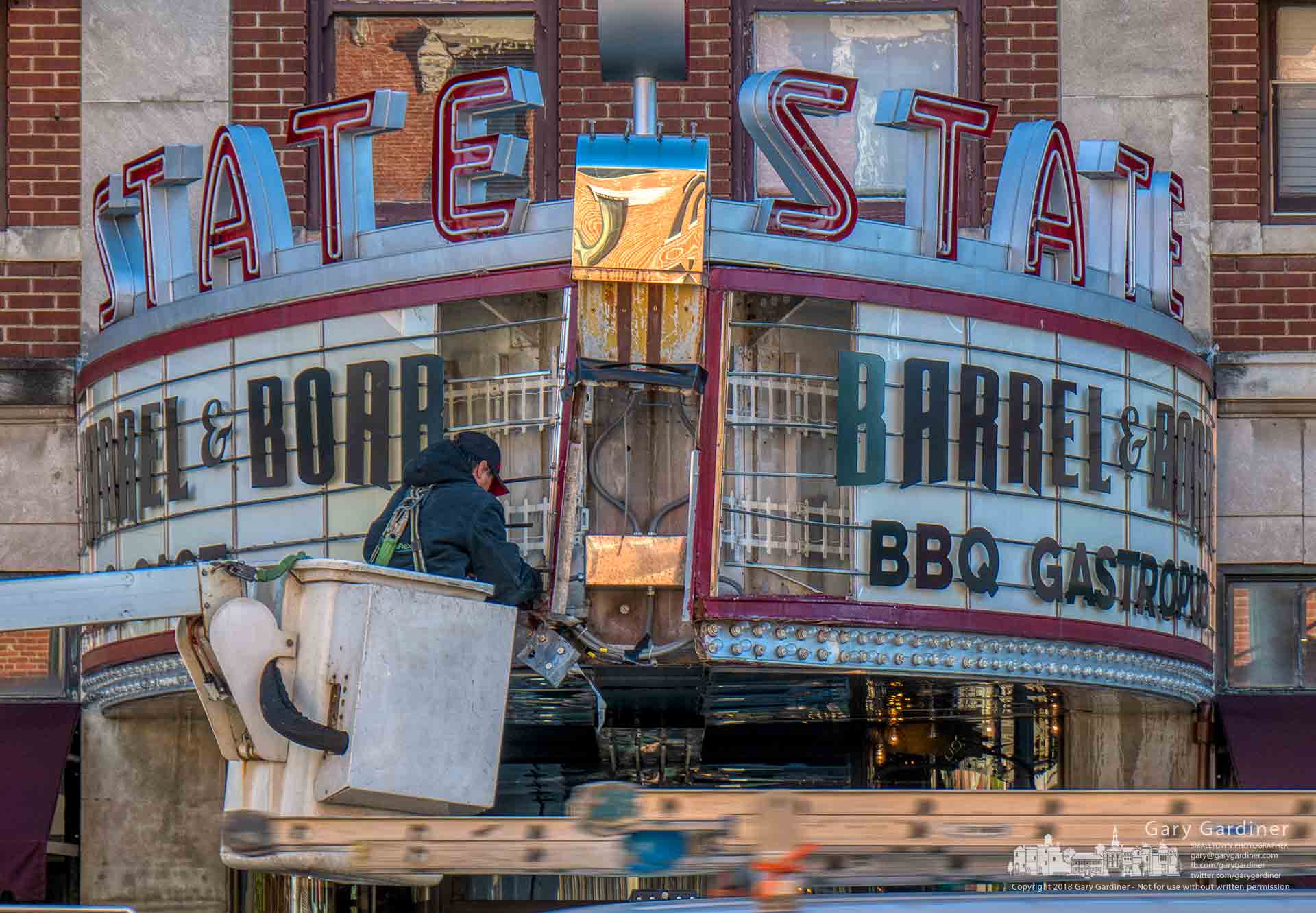 A sign company worker measures sections of the Barrel & Boar marquee as the company prepares to repair the iconic sign in Uptown damaged by a delivery truck. My Final Photo for Oct. 18, 2018.