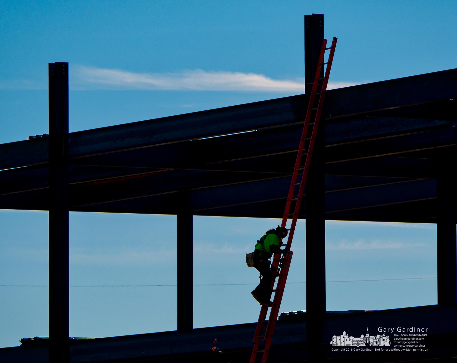 A steelworker descends a two-story ladder at the end of his workday building the superstructure for the new DHL headquarters building in Westerville. My Final Photo for Oct. 24, 2018.