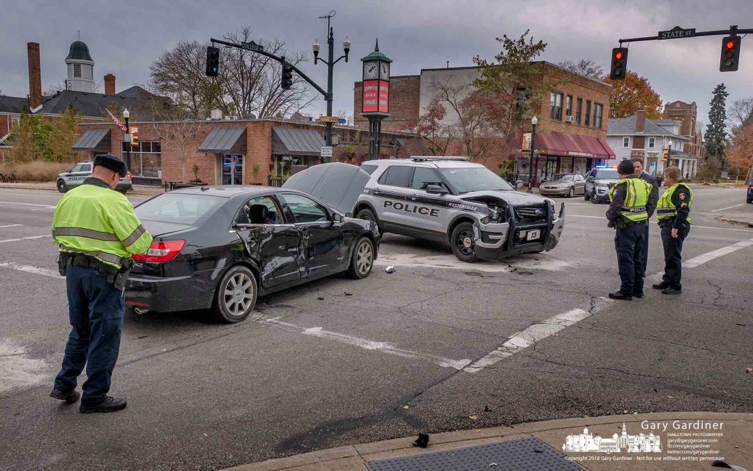 Cars crash at College and State