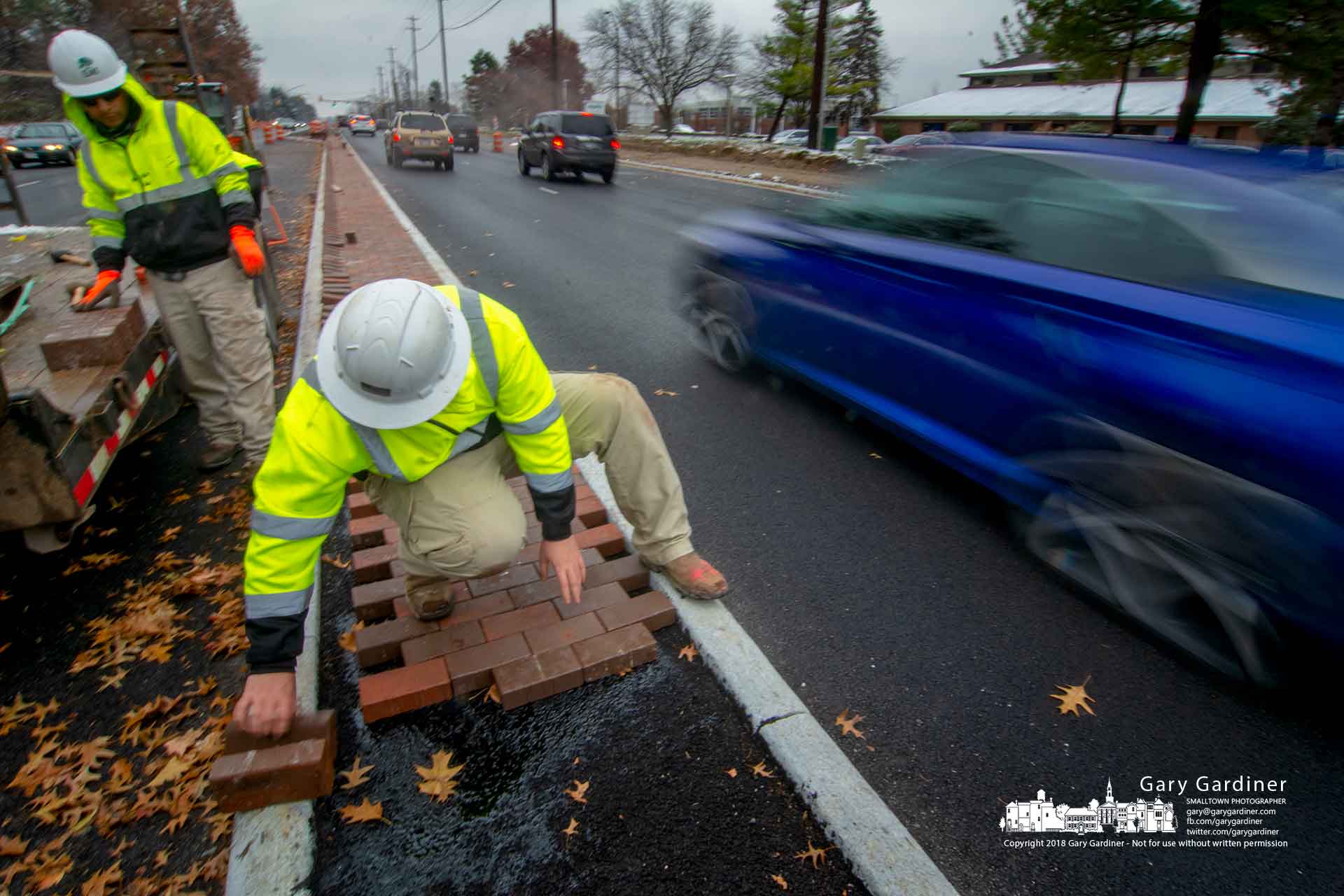 Bricklayers work in the narrow median on Cleveland Ave. about 100 yards north of Schrock Road as traffic resumes the speed limit as construction nears completion on the intersection. My Final Photo for Nov. 16, 2018.