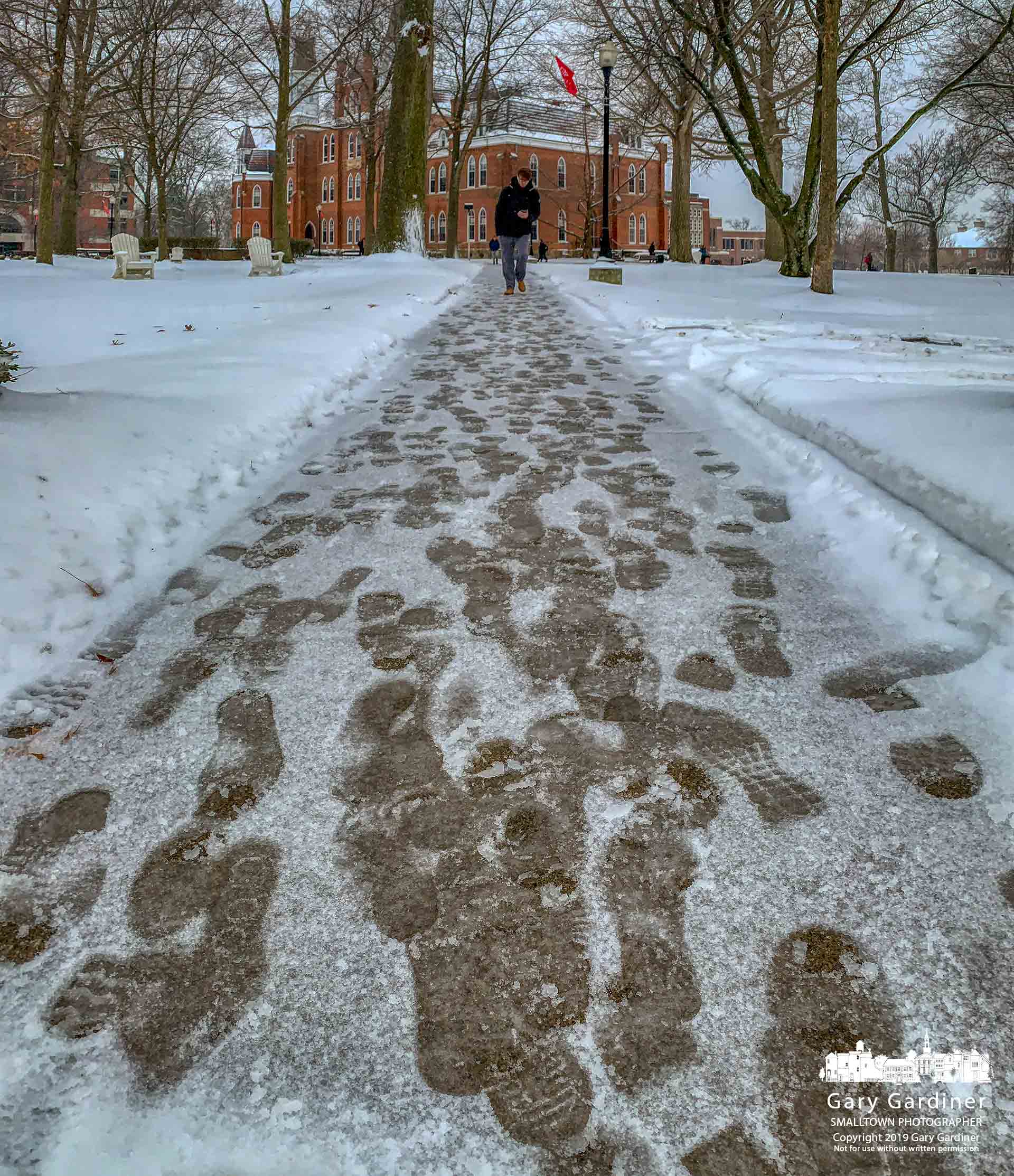 A collection of footprints leads to and away from Towers Hall at Otterbein University after an overnight snowstorm dropped more than three inches of snow that continued to fall after the school's sidewalks were first cleared. My Final Photo for Feb. 20, 2019.