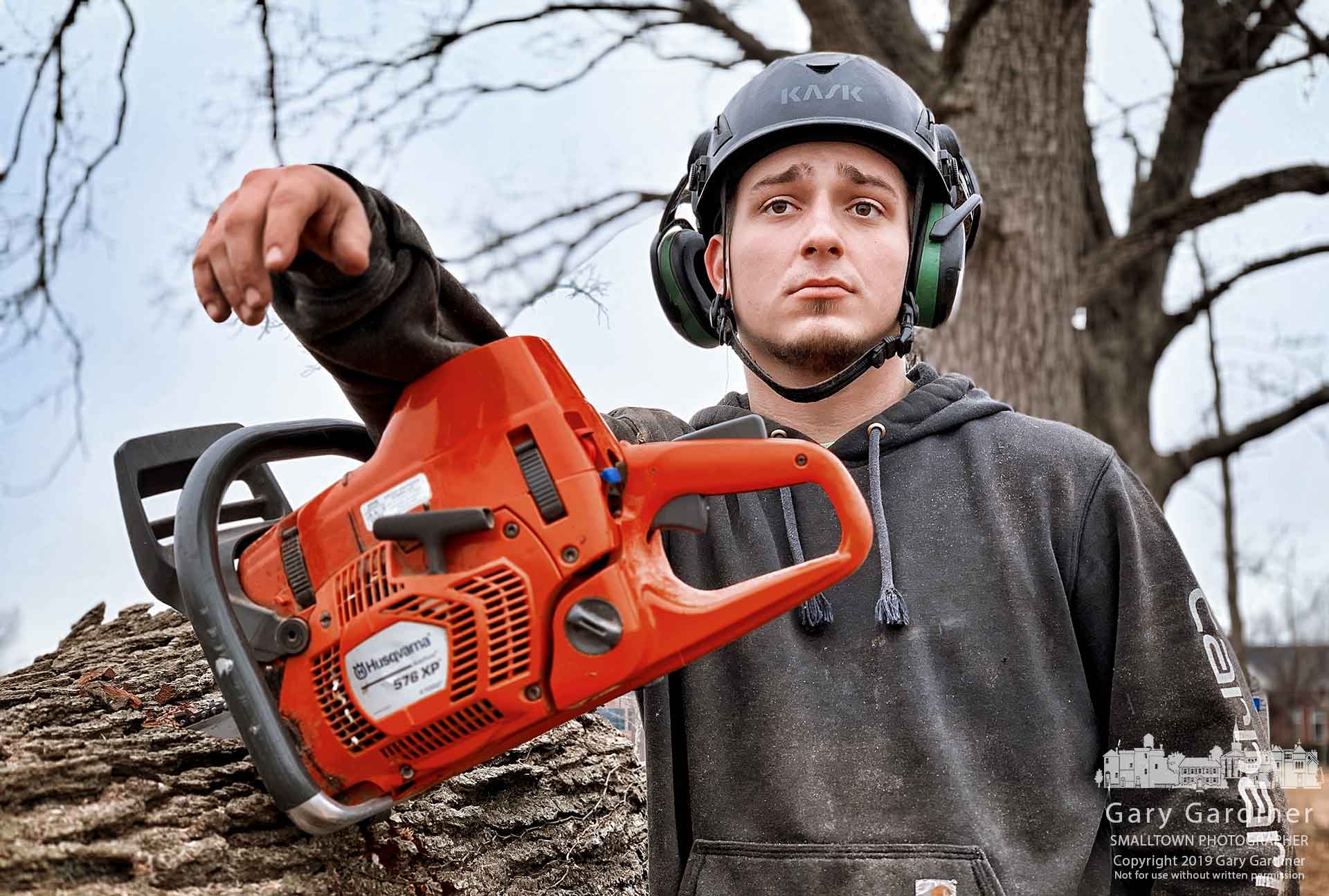 Jake Borne waits for the rest of his crew to clear away felled trees before continuing to cut trees on property being prepared for development at Polaris Parkway and Meridian Way. My Final Photo for March 2, 2019.