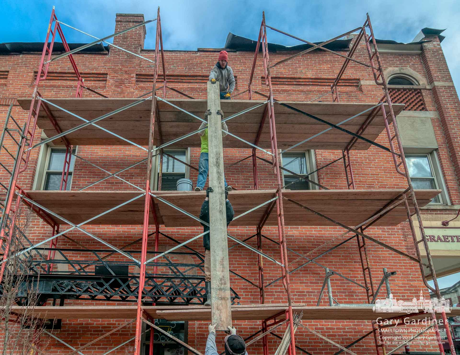 Workers remove the scaffolding erected in July 2018 at the building housing Graeter's to restore the facade to what it looked like about 50 years ago. My Final Photo for March 9, 2019.