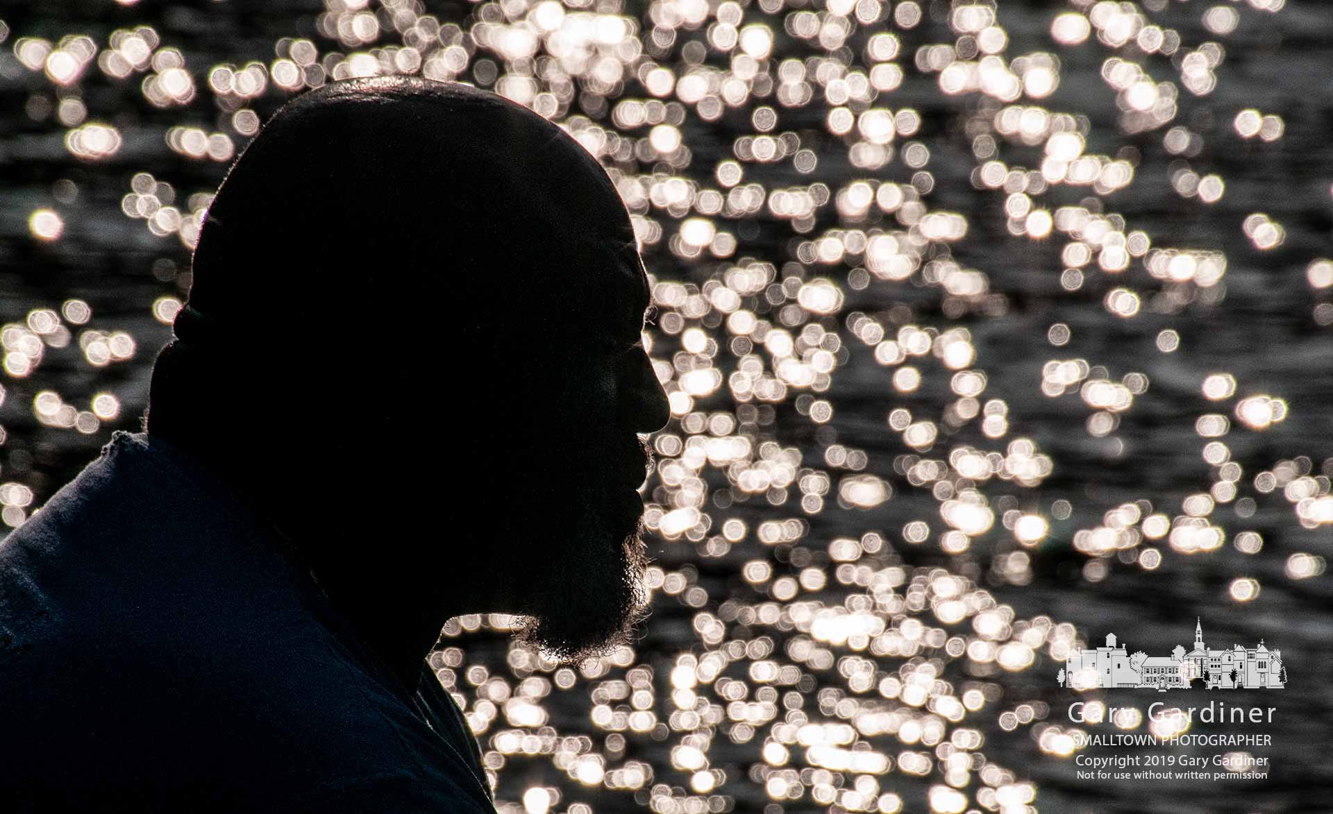 An angler silhouetted against the late afternoon sun reflecting off Hoover Reservoir sits quietly in his boat at the Red Bank docks waiting for another fish to take his bait. My Final Photo for June 2, 2019.