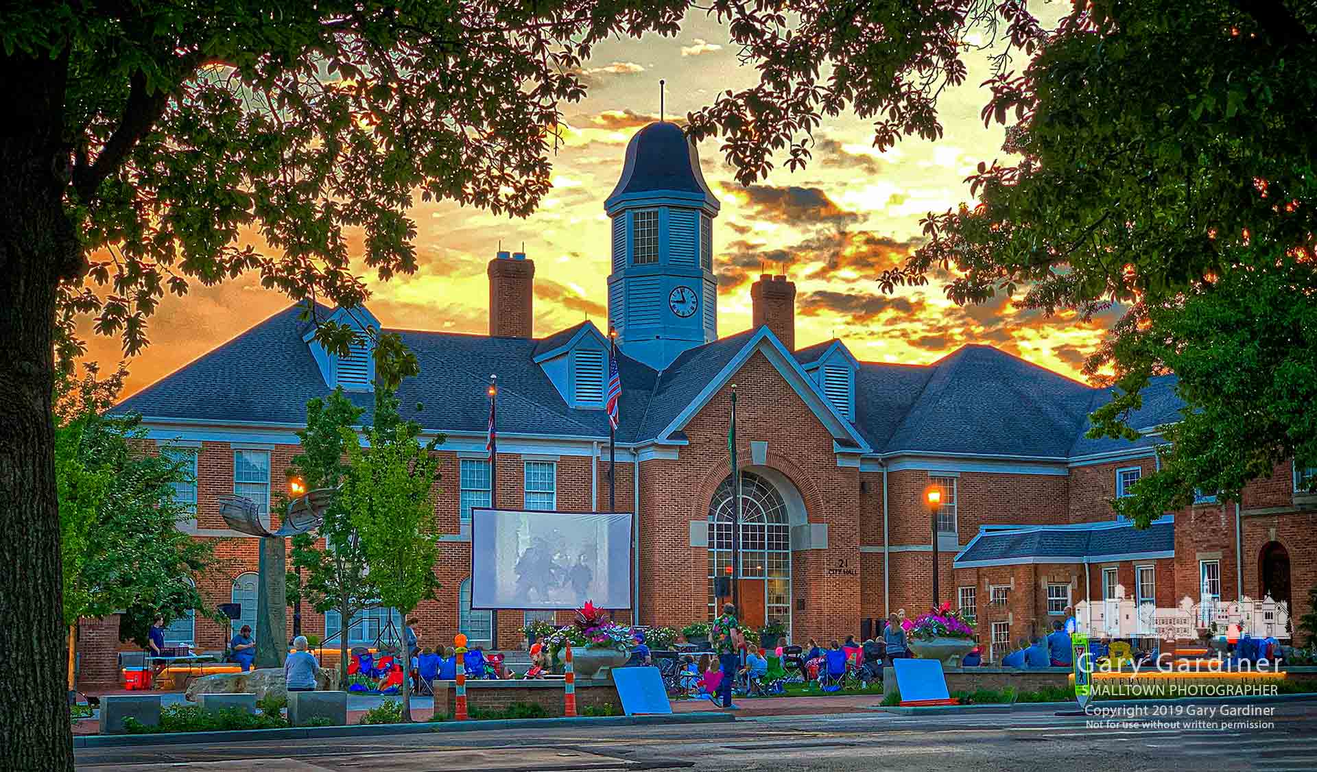 A crowd gathers on the green in front of city hall for Friday night movies on the first night of summer. My Final Photo for June 21, 2019.