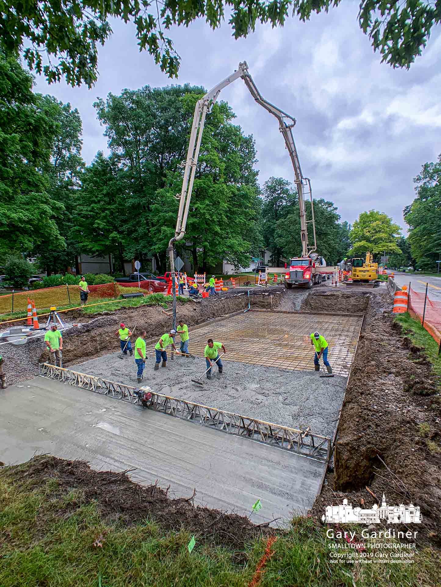 Construction workers pump concrete for the second of four underground holding tanks on Spring Road that are designed to help manage heavy stormwater runoff. My Final Photo for June 18, 2019.