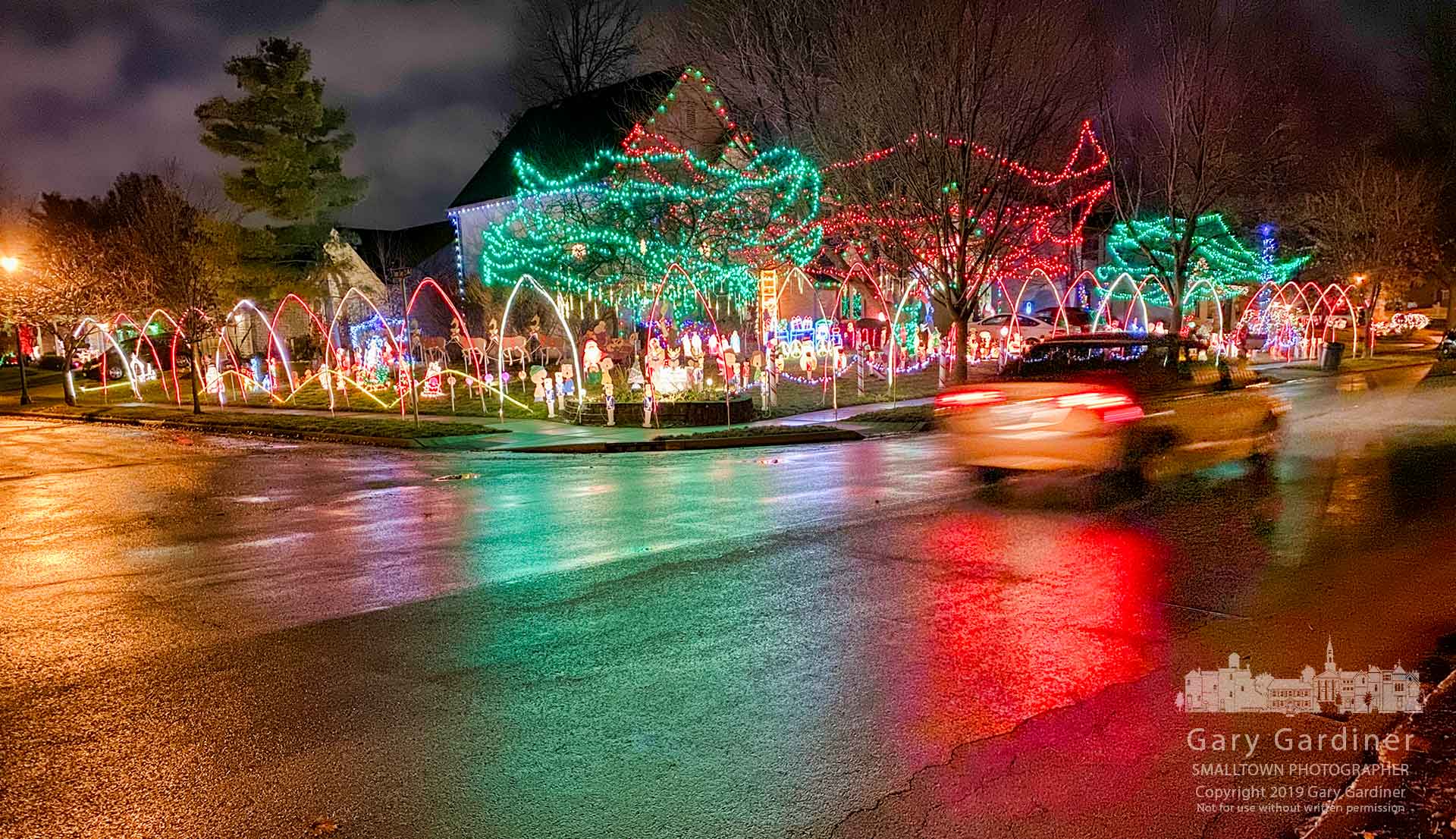 A car drives past the annual Christmas lights display in front of a home on Olde Mill Drive in Westerville. My Final Photo for Nov. 30, 2019.