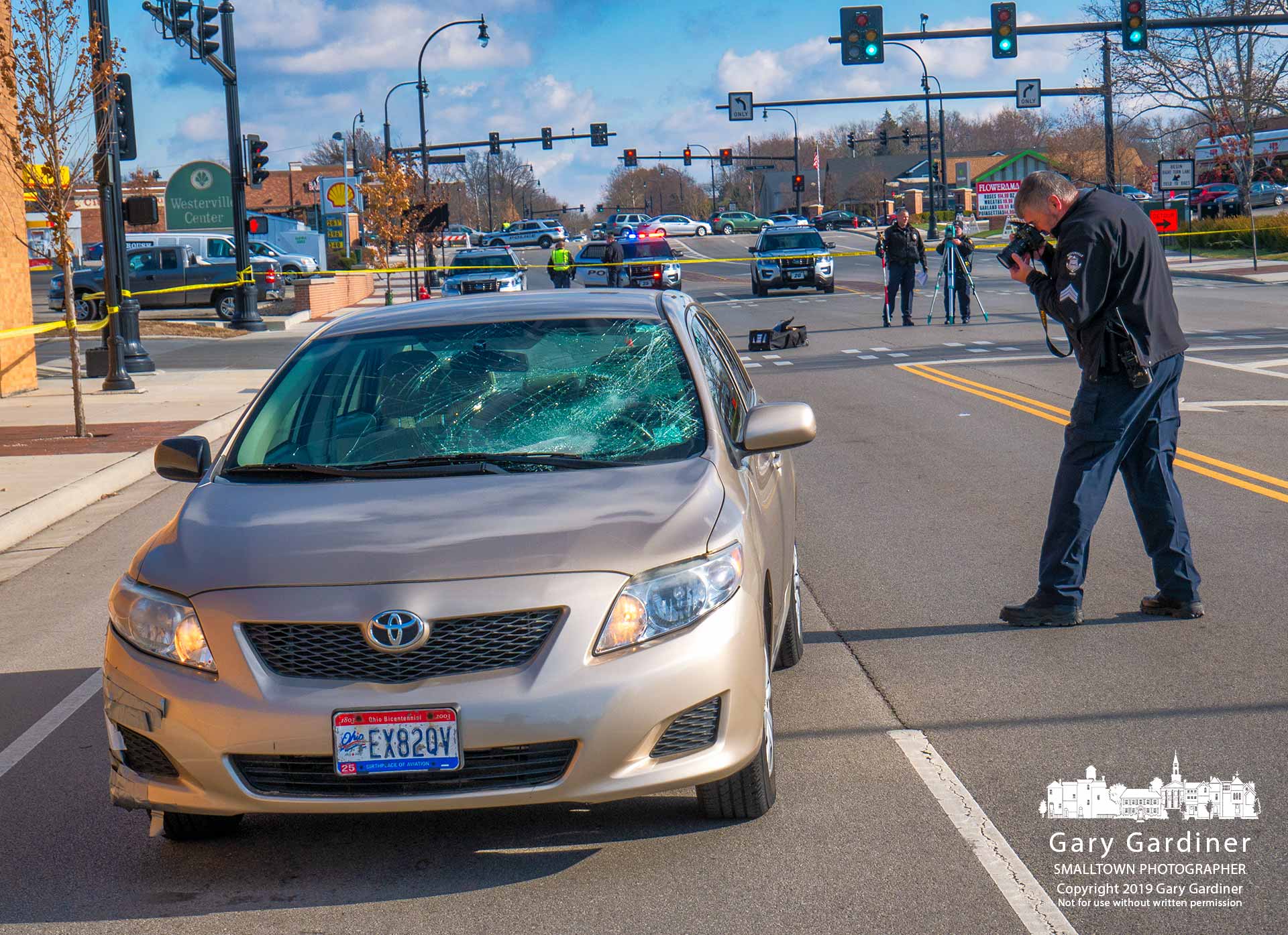 The Westerville Police Department accident investigation team collects data and evidence from a car and intersection where a pedestrian was struck while crossing Schrock near Roush Hardware. My Final Photo for Dec. 4, 2019.