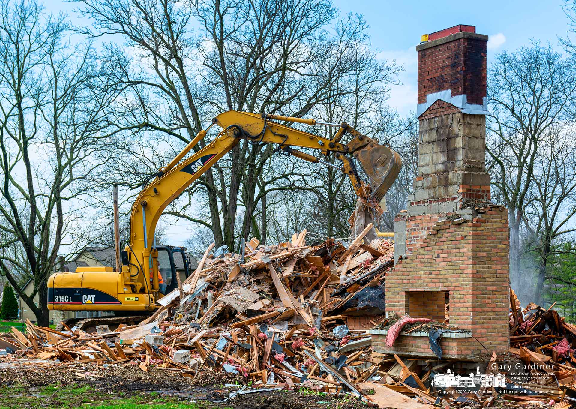 Only the chimney remains recognizable as a demolition crew removes the McVay home from its location on Hempstead Road where Westerville will build a new park. My Final Photo for April 7, 2020.