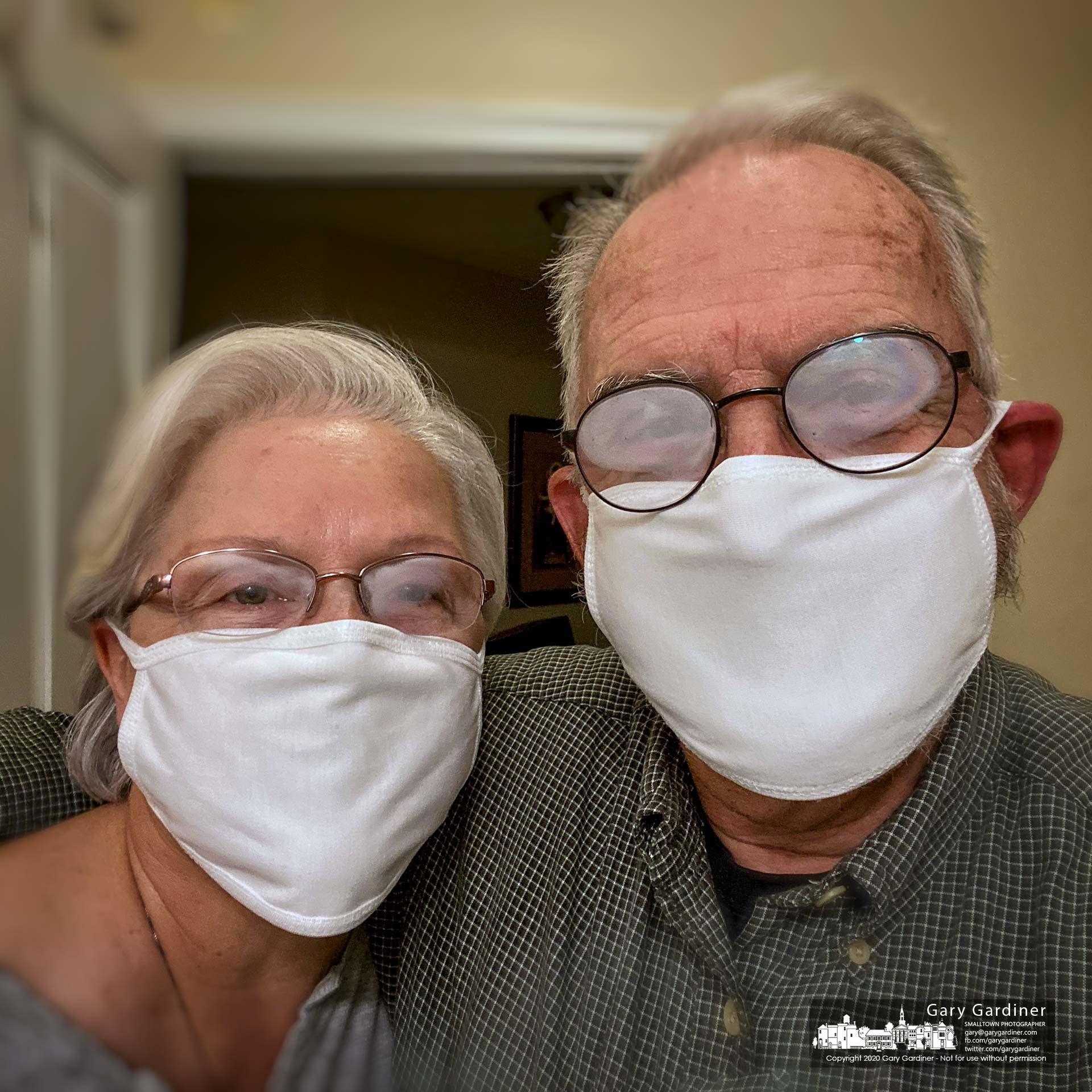 Sherry and Gary Gardiner wear their newly obtained cotton masks as minimum protection against spreading the COVID-19 virus although they spend most of their days at home. My Final Photo for April 5, 2020