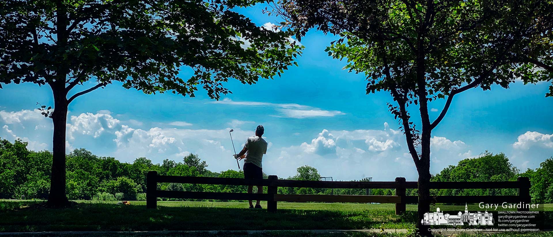 A golfer strikes a few practice balls from the edge of a field at Otterbein University as he prepares for a match against his son the next day. My Final Photo for June 20, 2020.
