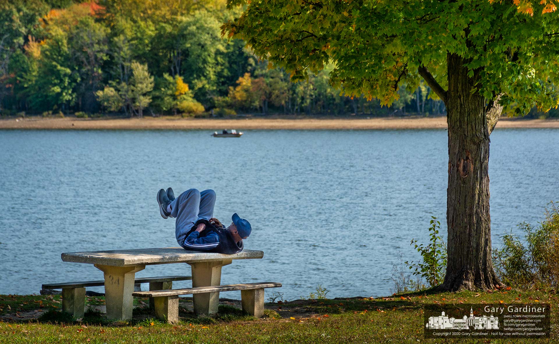 A noontime visitor at Red Bank Park on Hoover Reservoir uses one of the picnic tables to get in a round of leg lifts as part of his exercise routine. My Final Photo for Oct. 9, 2020.
