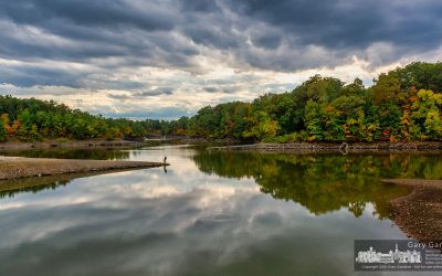 Father And Son Fishing The Shoreline