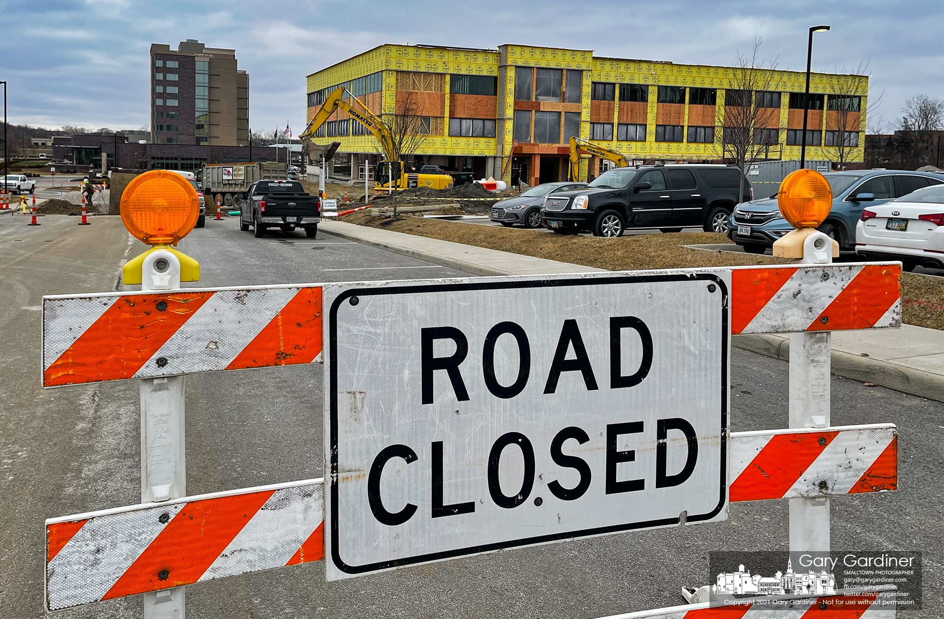 A sign marks a closed section of road between Africa Road and Altair Parkway where contractors are installing a new storm sewer connected to the COPC office under construction nearby. My Final Photo for Jan. 28, 2021.