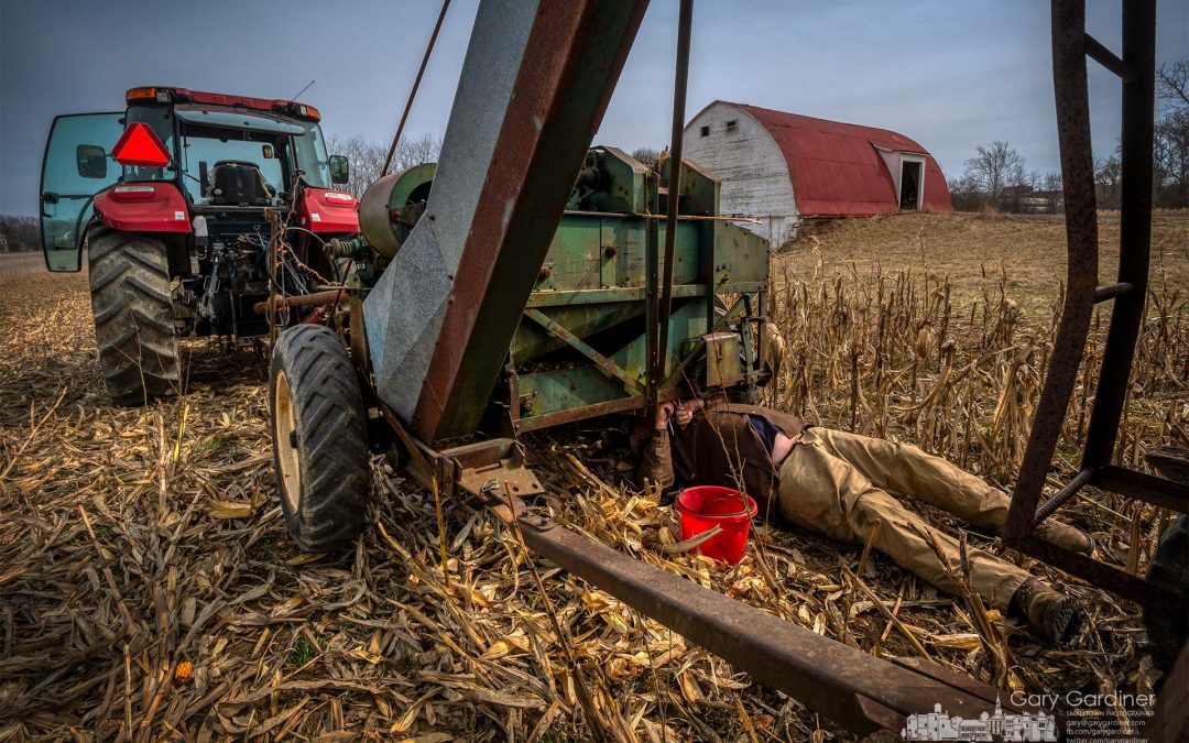 Farmer Fixing The Tools