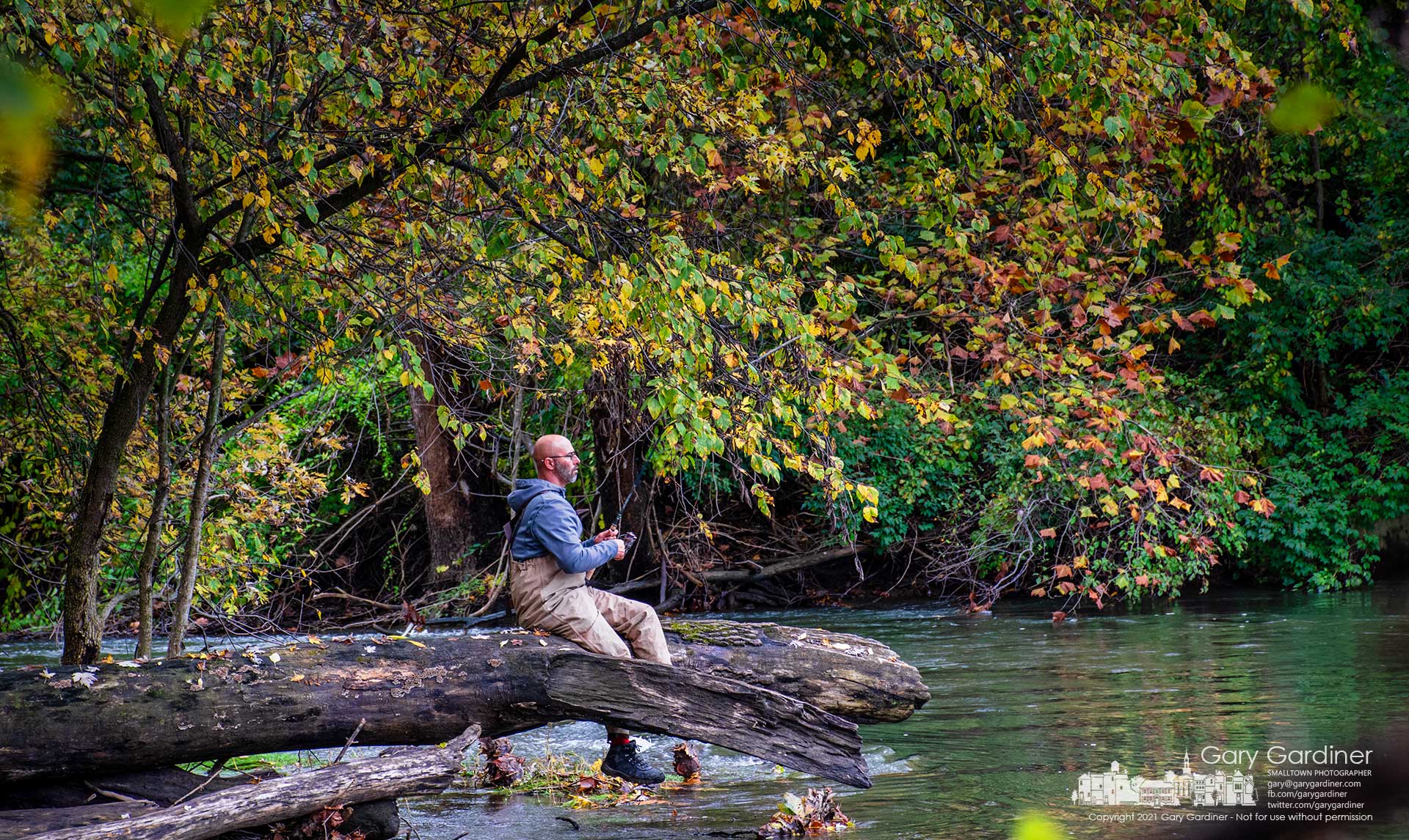 A fisherman uses a fallen tree dangling over the waters below the Alum Creek low-head dam hoping the extension might increase his chances of catching more or larger fish from the creek. My Final Photo for Oct. 30, 2021. 