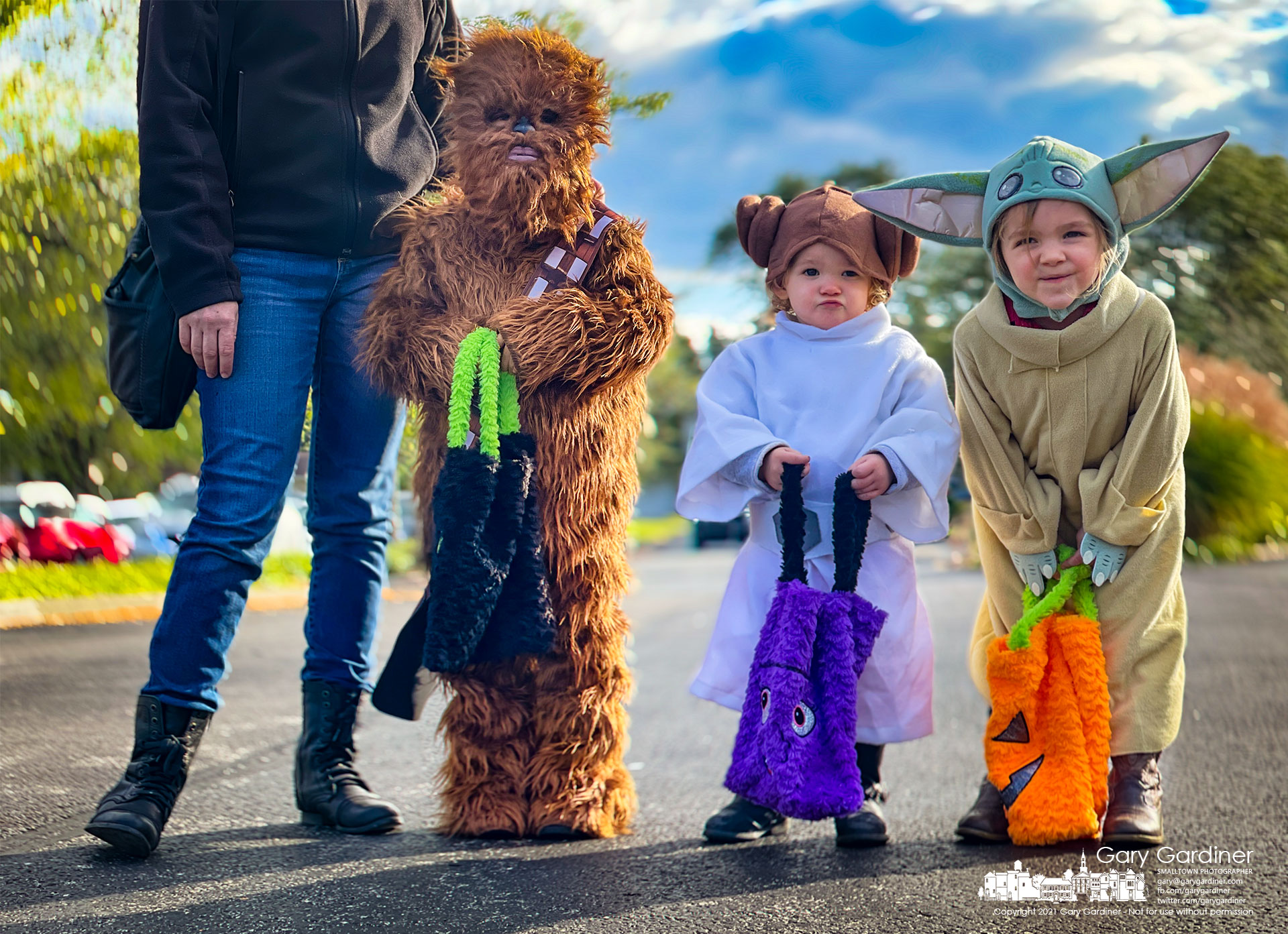 A trio of young Star Wars fans pause before going to "Trunk or Treat" at Westerville Community Church where they hope they might use The Force to fill their bags with candy. My Final Photo for Oct. 16, 2021.