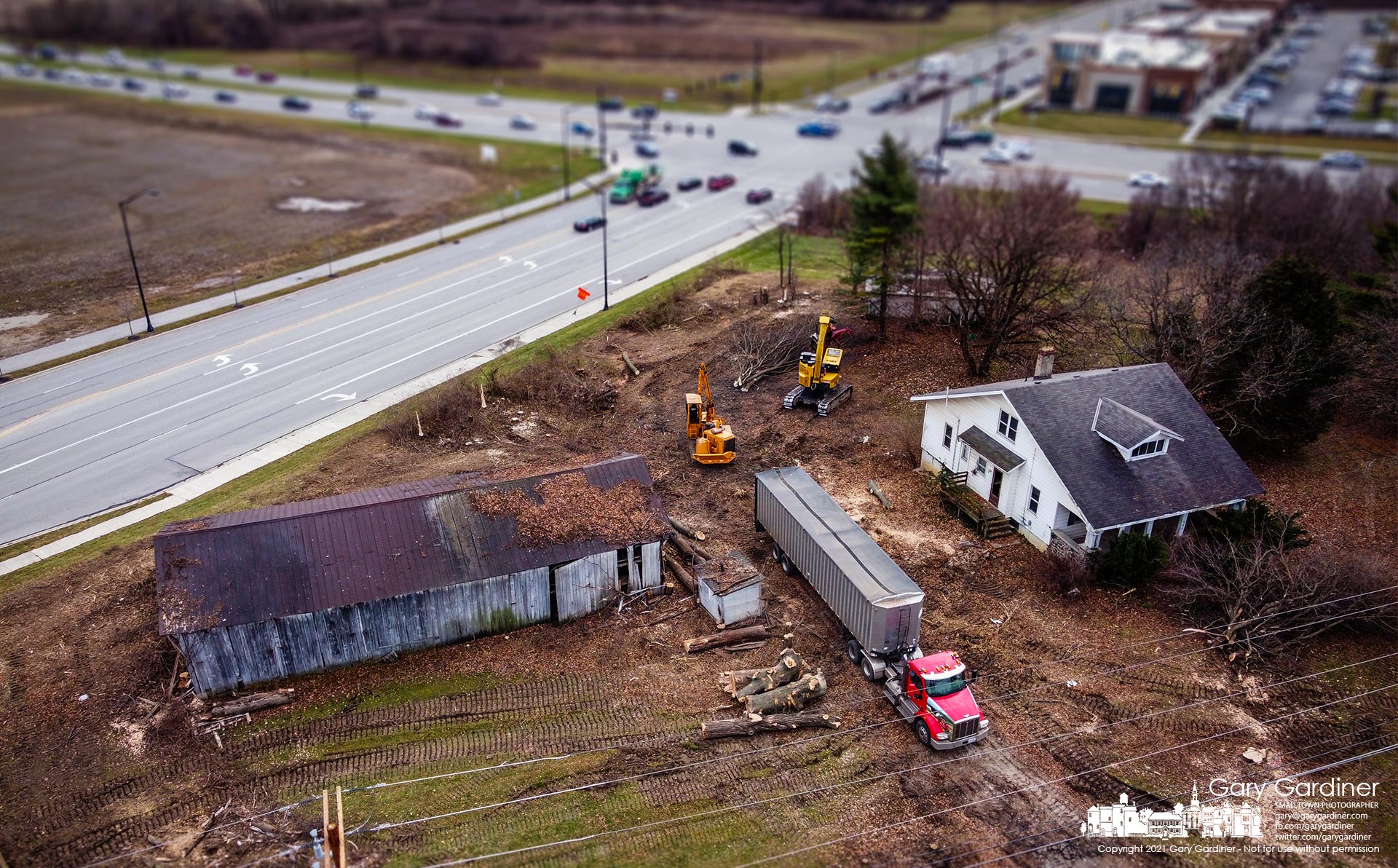 A work crew clears trees from around an old farmhouse and barns at Polaris Parkway and Worthington Galena Road where a Sheetz convenience store will begin construction in 2022. My Final Photo for Dec. 15, 2021.