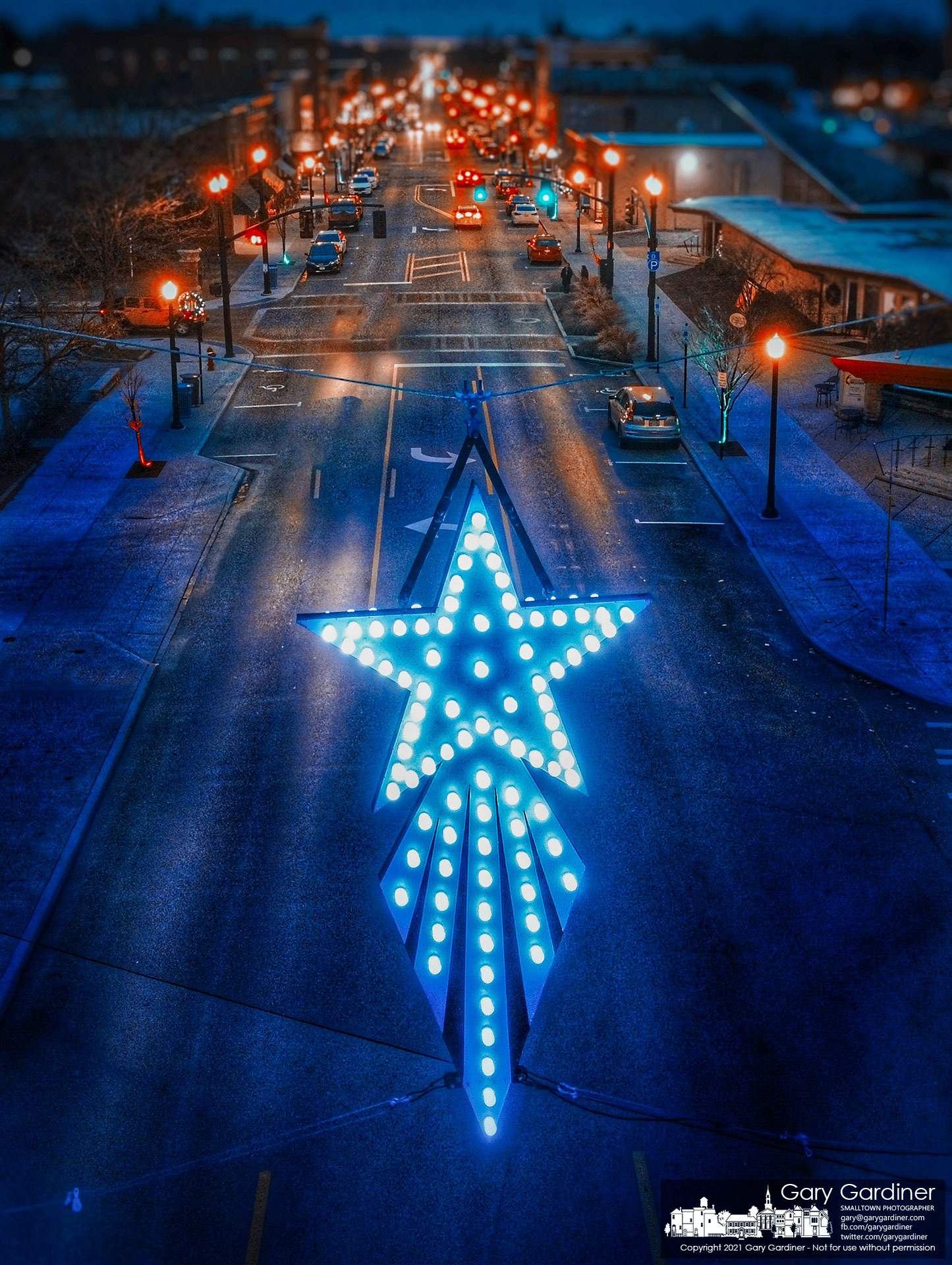 The Westerville antique Christmas Star, now known as the Holiday Star, sits above State Street at its new location two blocks north of Main and State where it used to be hung. My Final Photo for Dec. 7, 2021.  