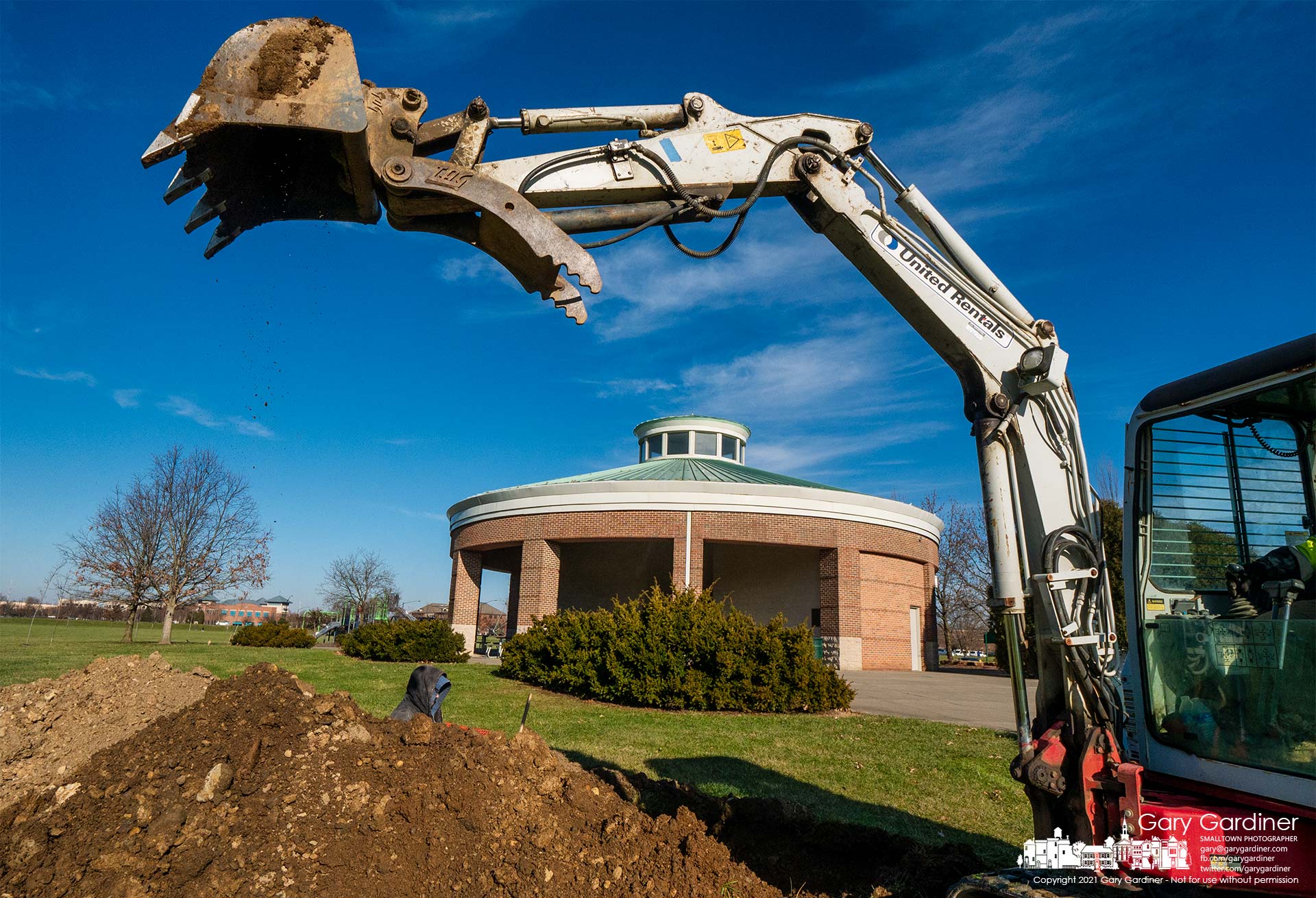 A construction crew excavates for conduits that will be used for the new veterans memorial being built at the sports field at the community center. My Final Photo for Dec. 21, 2021.