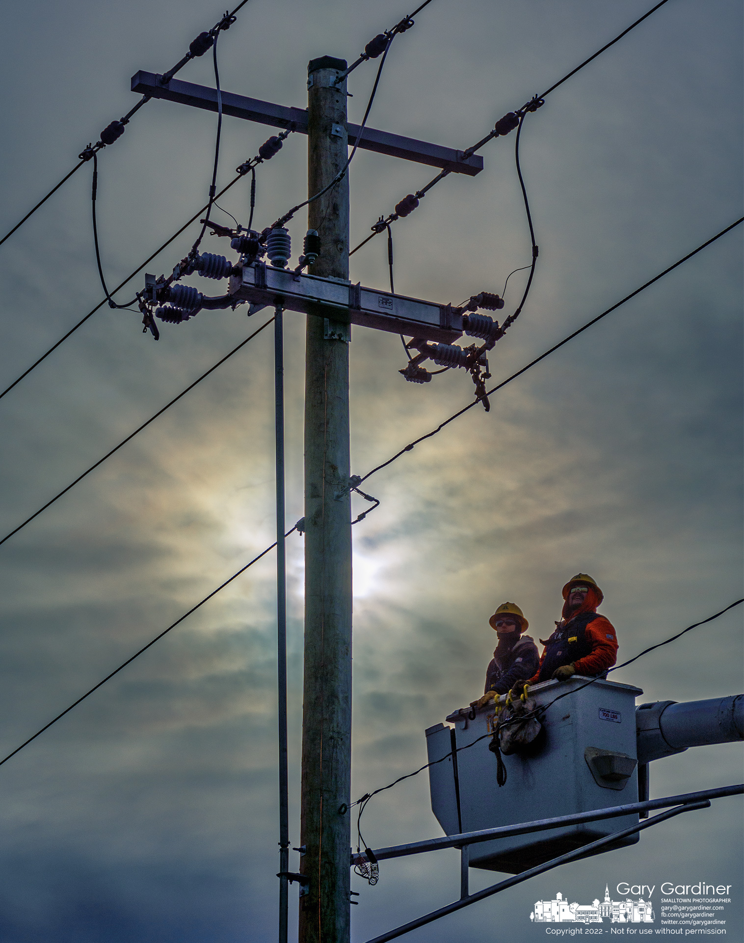 A city electric crew watches as switches are tested after the utility pole was replaced. My Final Photo for Jan. 19, 2022.