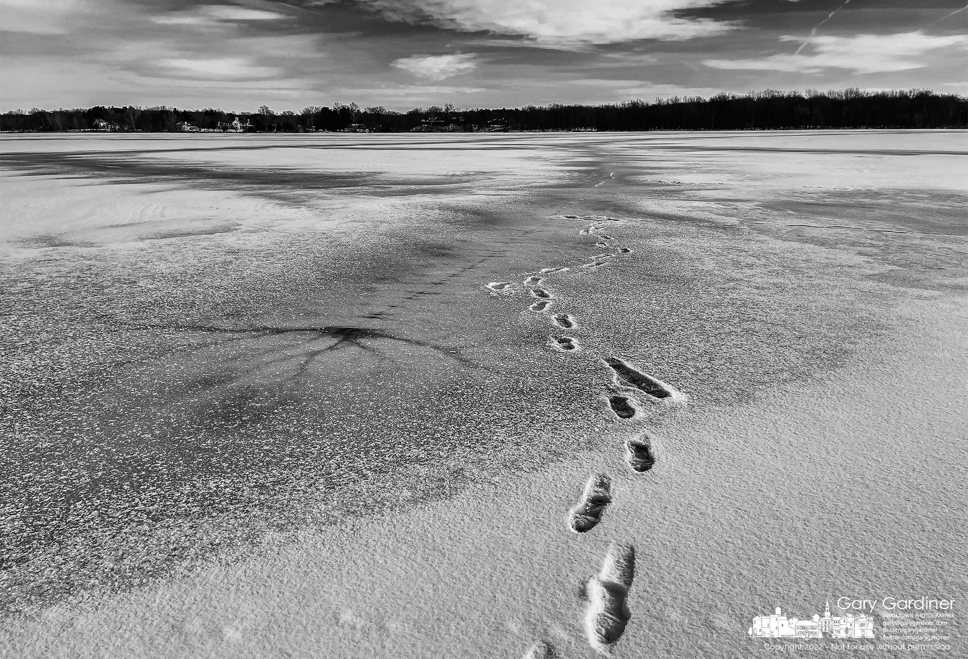 A set of tracks lead to the shore from the frozen and snow-covered surface of Hoover Reservoir at Rad Bank Park. My Final Photo for Jan. 27, 2022.
