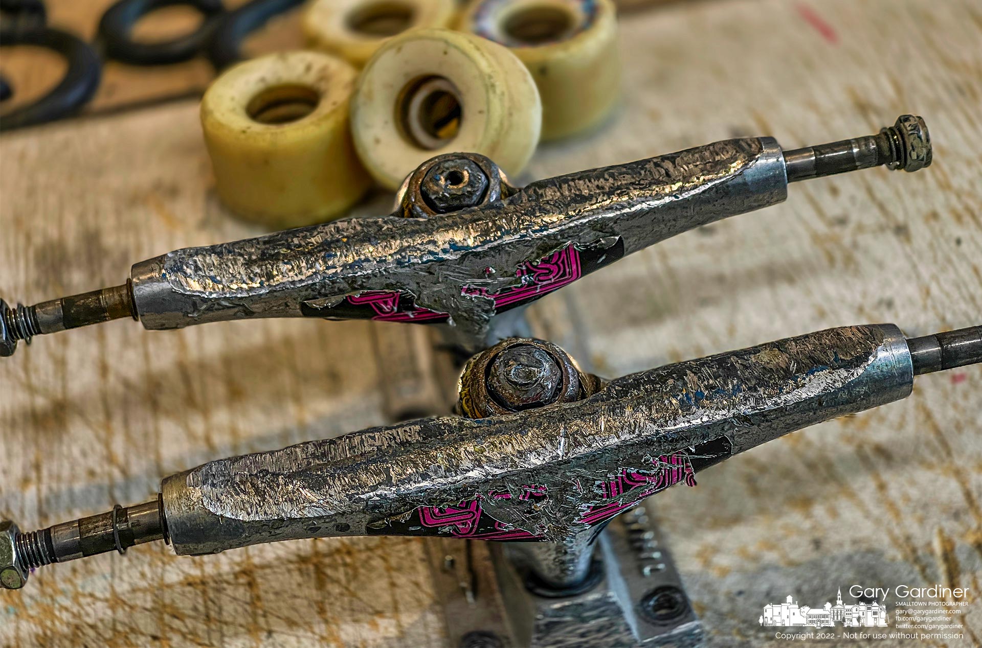 A set of worn-out skateboard trucks and wheels sit on the counter at Old Skool Skateboard where they are headed to recycling after they were removed and replaced with new equipment. My Final Photo for Feb. 19, 2022.