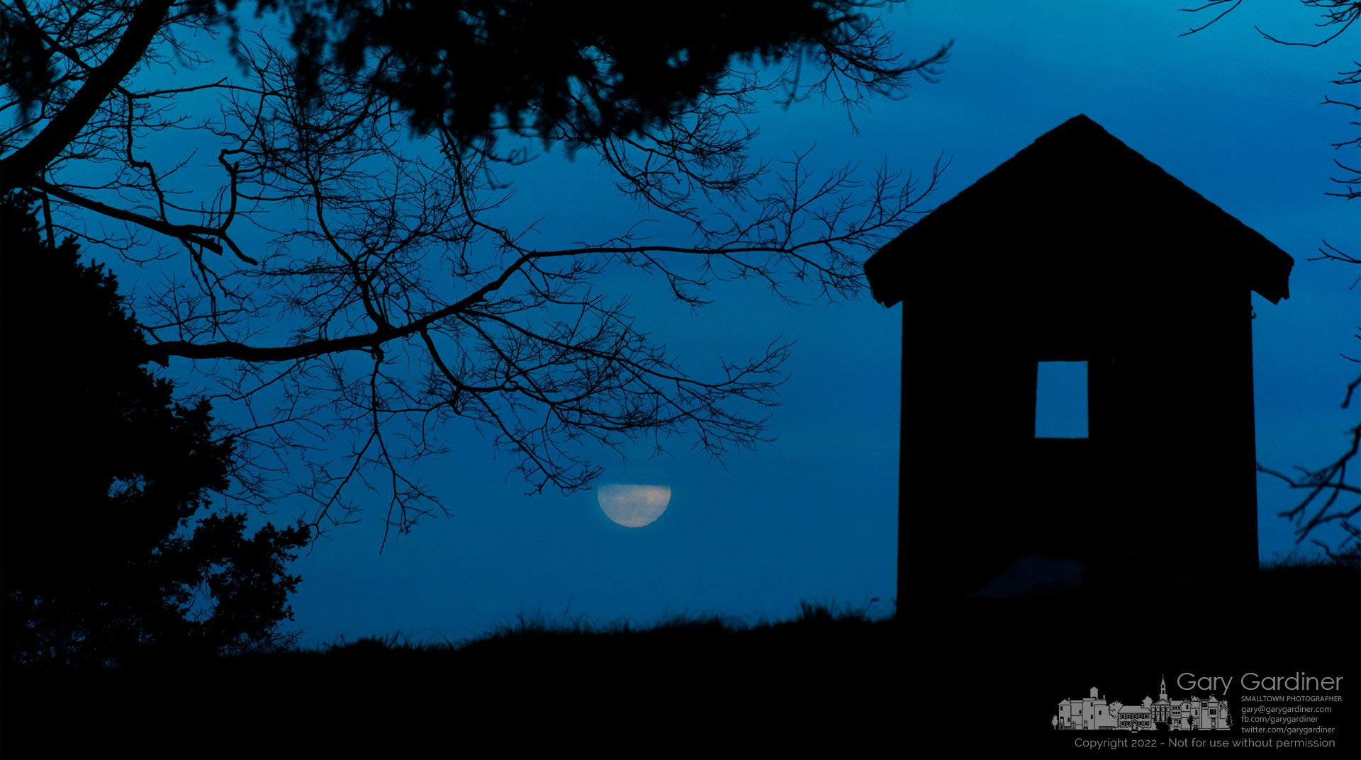 A full moon rises behind a layer of clouds laying over a Sharp Farm outbuilding on Africa Road. My Final Photo for March 17, 2022.
