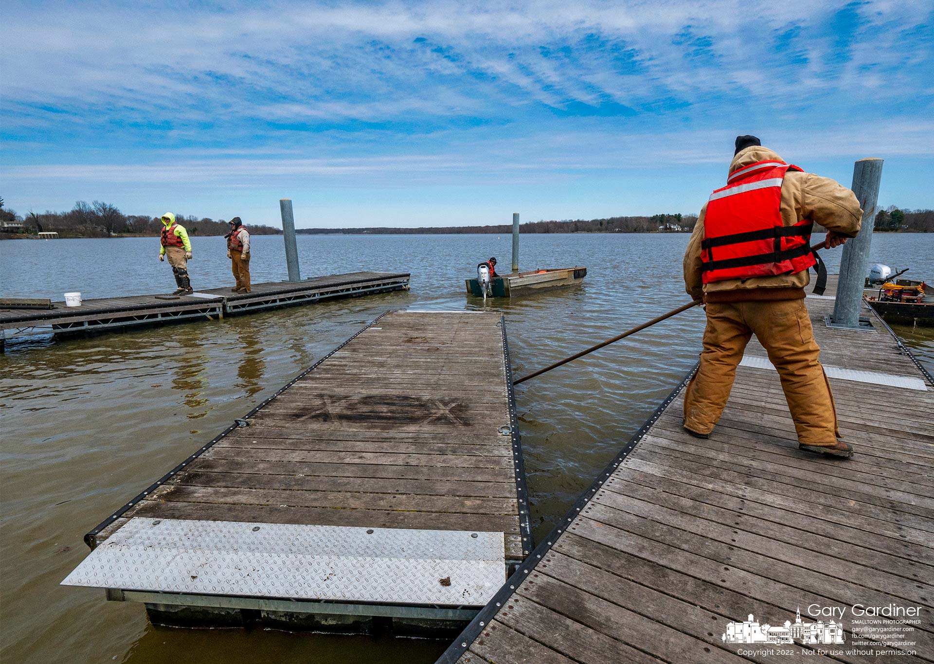 Workers install docks at the boat ramp at Red Bank on Hoover Reservoir beginning the task of installing docks on all the ramps on Hoover as warmer weather begins the spring and summer season. My Final Photo for March 29, 2022.