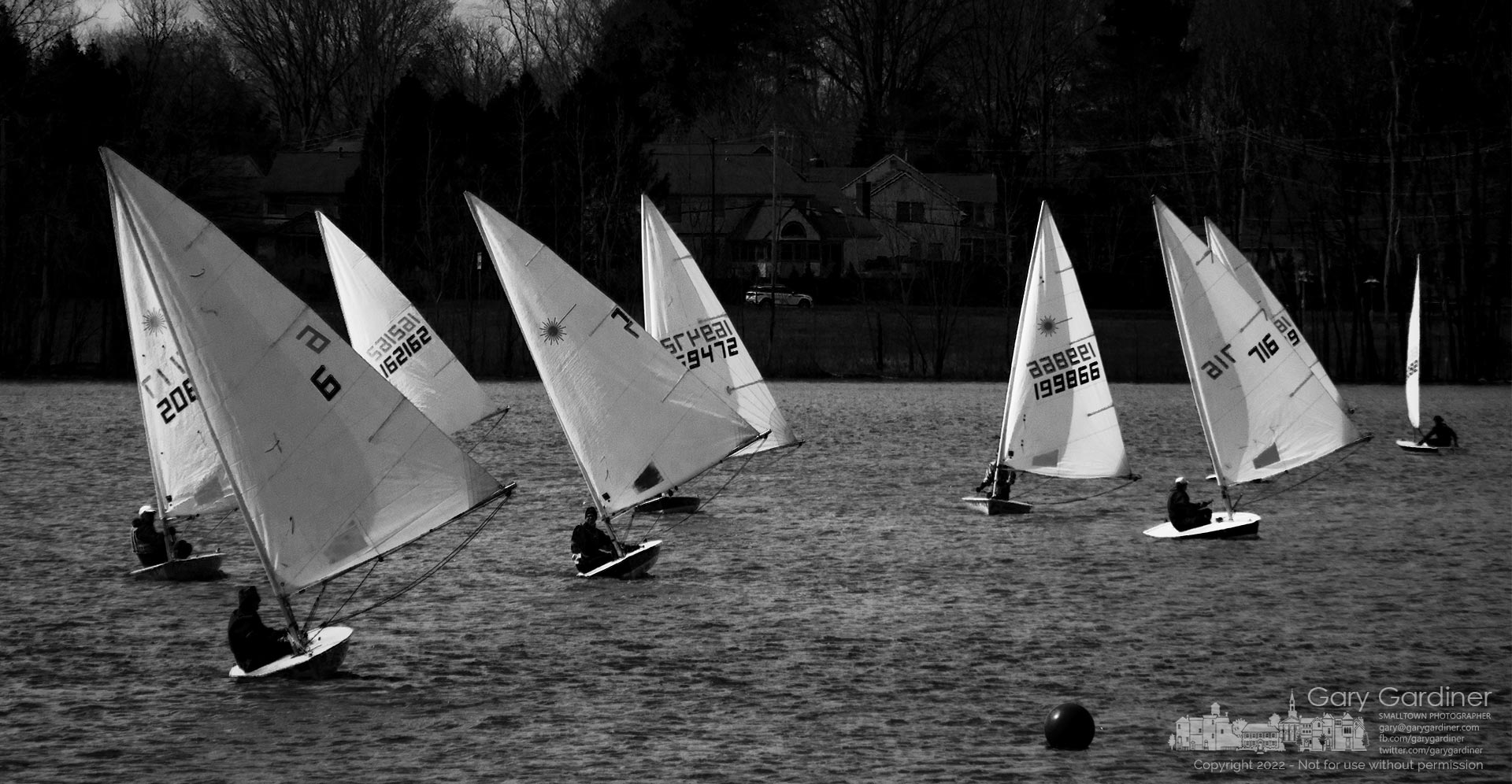 Sailors on Hoover Reservoir run with the wind as they approach a buoy marking a turn in one of their friendly races Sunday afternoon on the lake. My Final Photo for March 20, 2022.