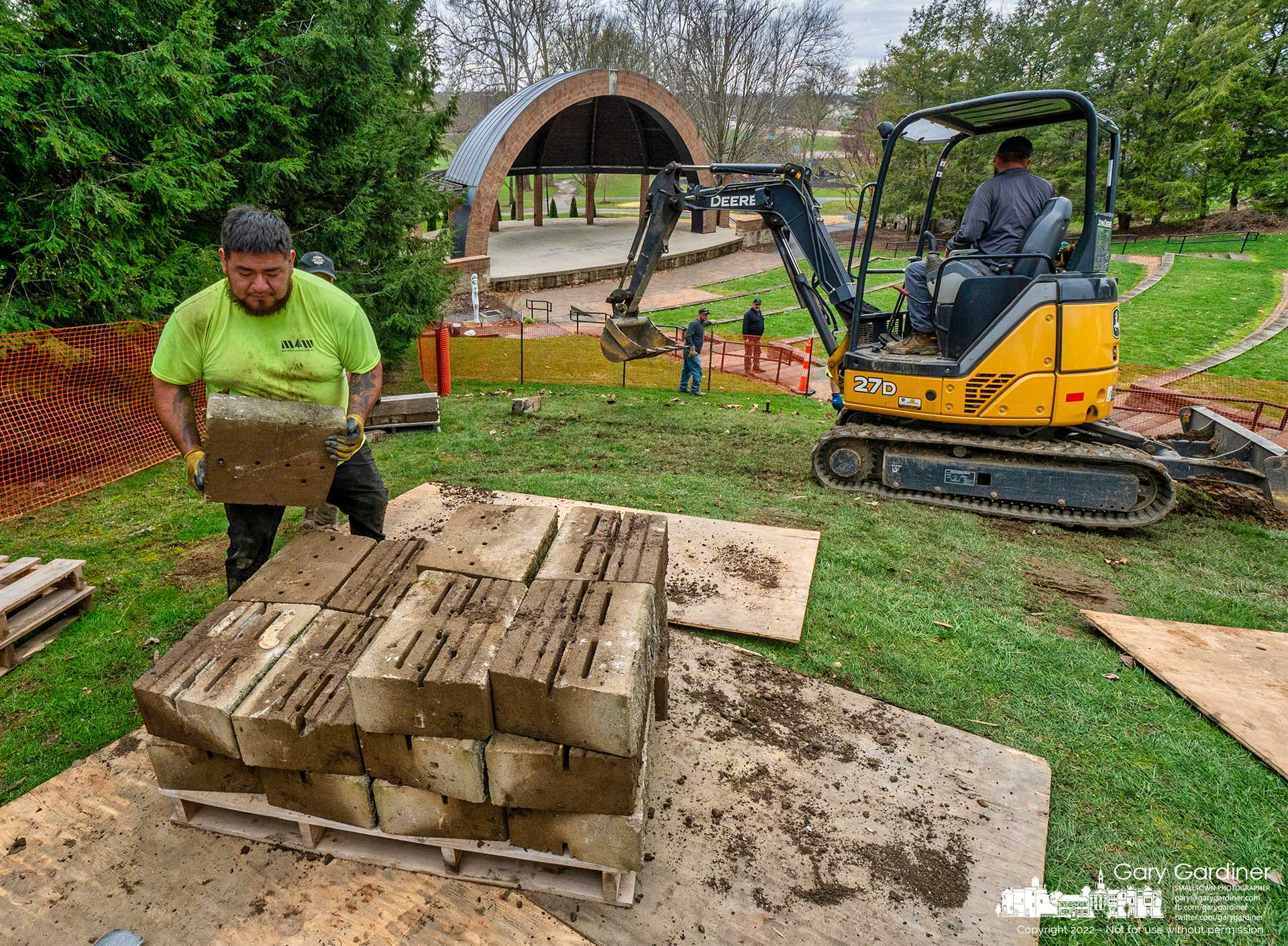 Workers remove blocks from a retaining wall at the Alum Creek Park Amphitheater where it will be stabilized and rebuilt with new blocks. My Final Photo for April 6, 2022.