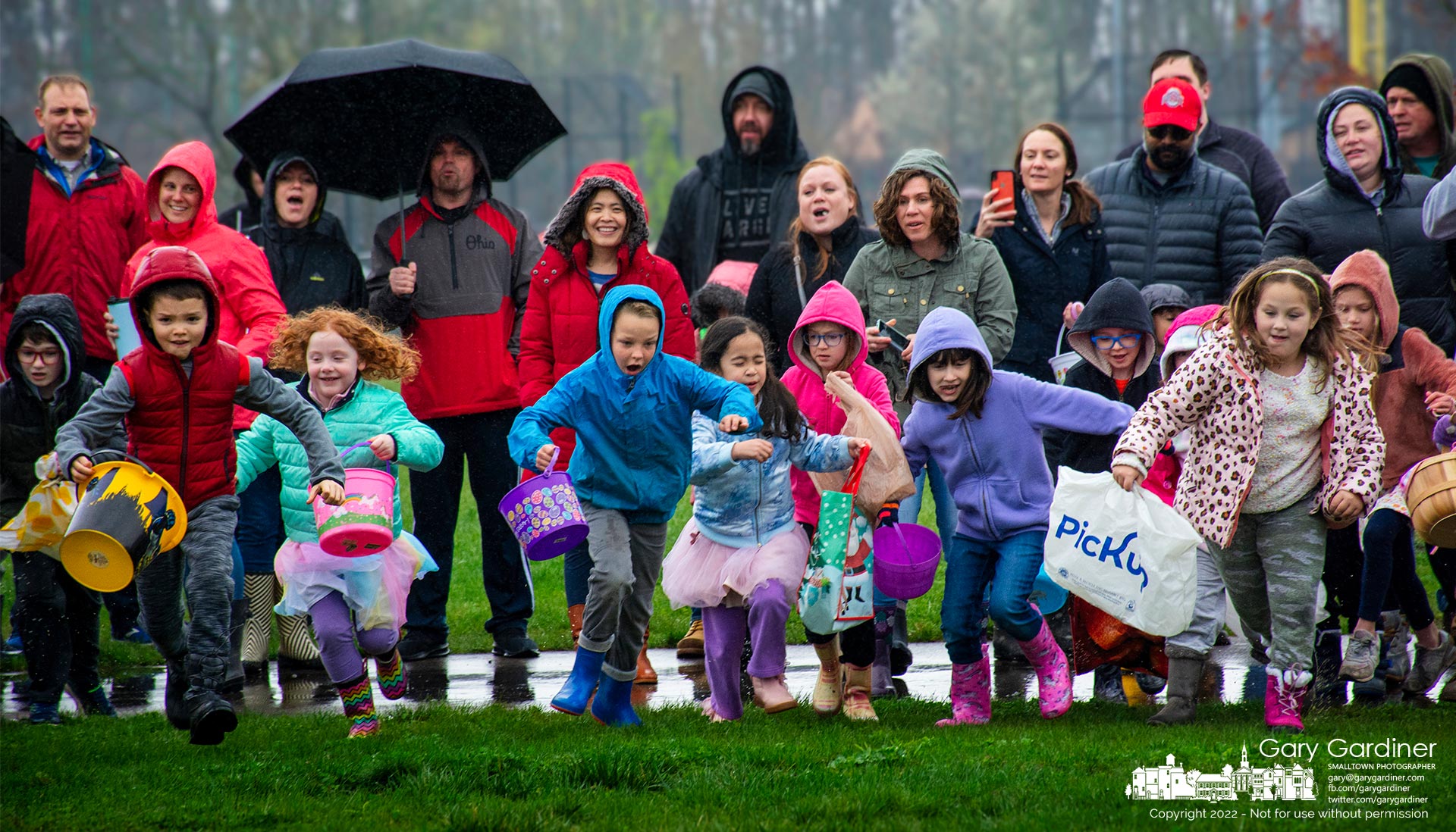 A group of youngsters cheered by their parents race toward a collection of plastic Easter eggs in one of the Eggstravaganza events at Hoof Woods Park. My Final Photo for April 16, 2022.