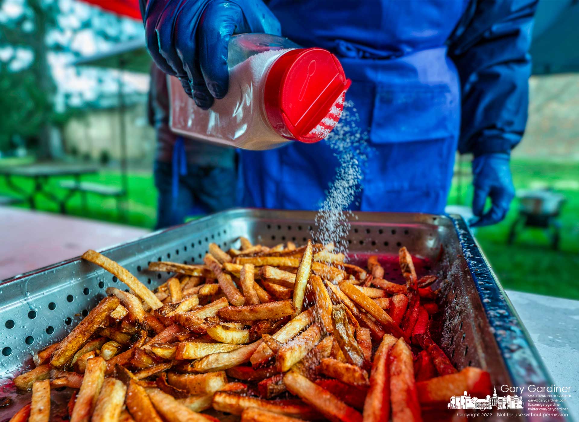 Handcut french-fried potatoes get a sprinkling of salt before joining the serving line at the Westerville Masonic Hall's annual fish fry to benefit Special Olympics. My Final Photo for April 8, 2022.
