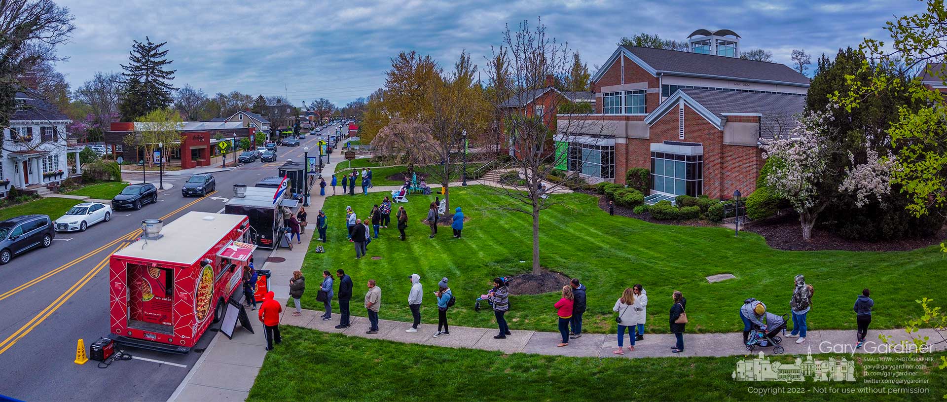 Hungry lunch-goers line up at food trucks lining State Street in front of the Westerville Library for a belated Library Appreciation Week celebration to promote libraries and their workers. My Final Photo for April 27, 2022. 