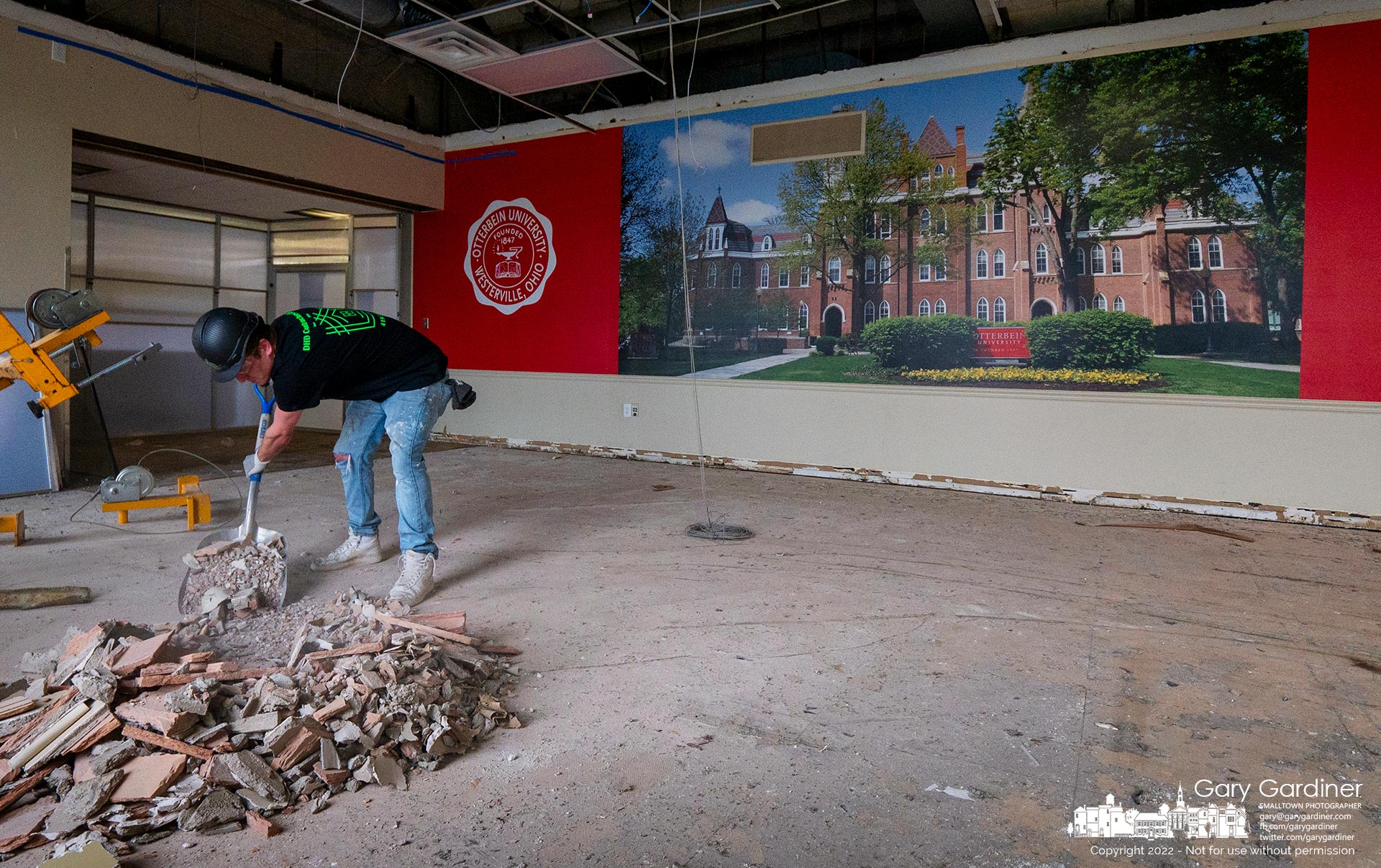 A construction worker shovels debris collected from the demolition of a dining room at the Otterbein University Campus Center as it undergoes a multi-million dollar renovation. My Final Photo for April 13, 2022.